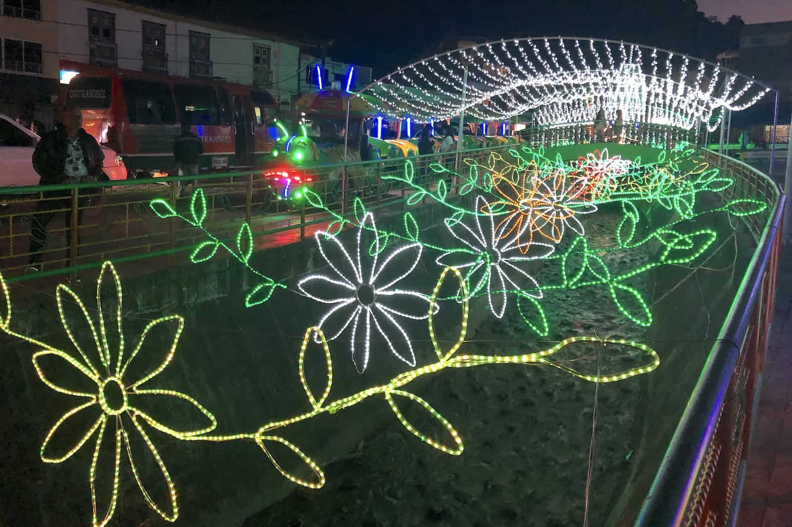 Colorful lights above the canal representing flowers