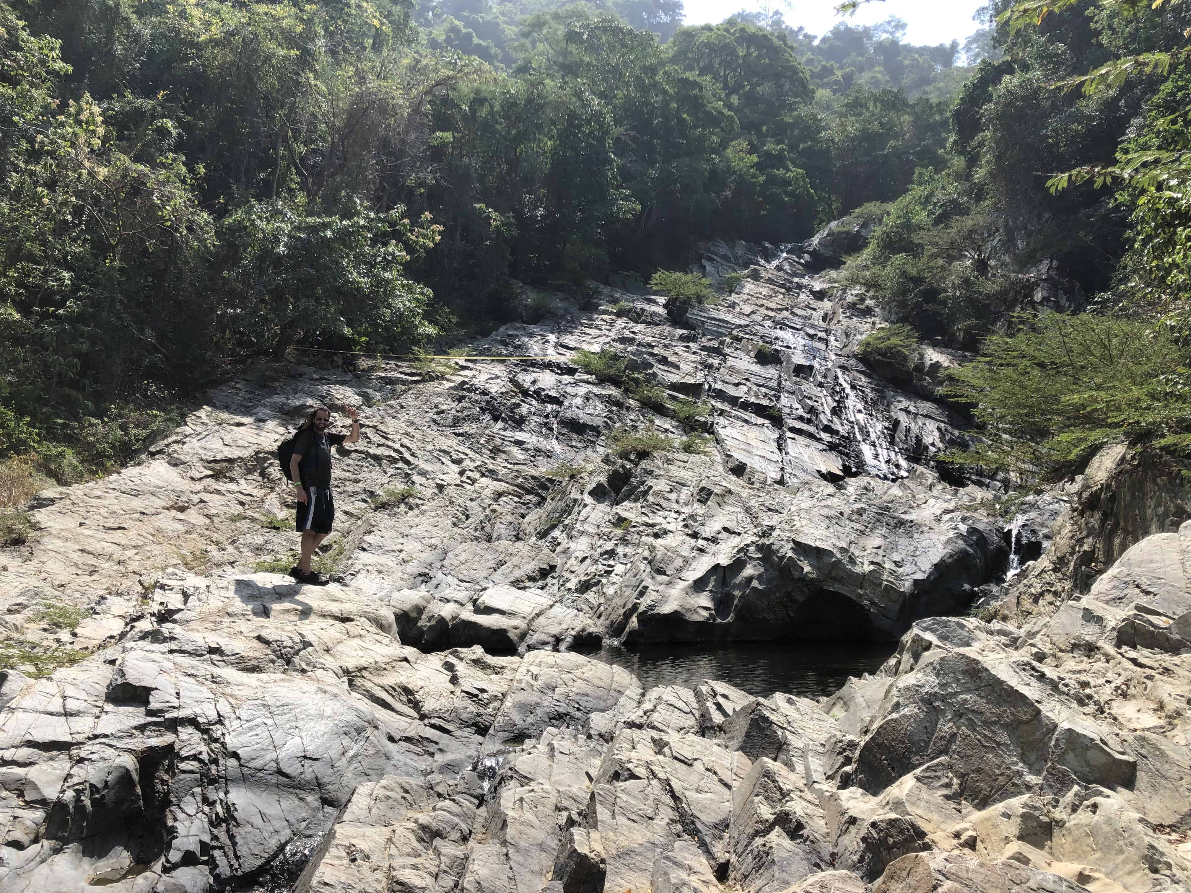 Climbing the rocks to more swimming holes at Quebrada Valencia, Magdalena, Colombia