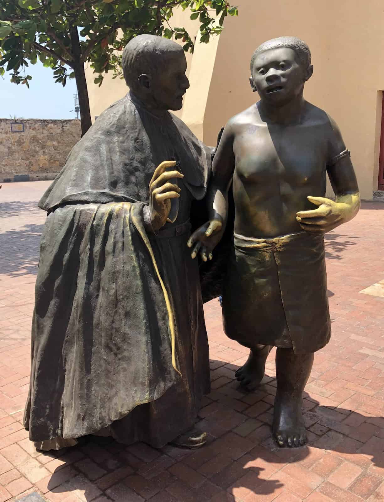 Statue of San Pedro Claver and a young slave boy in Cartagena, Colombia