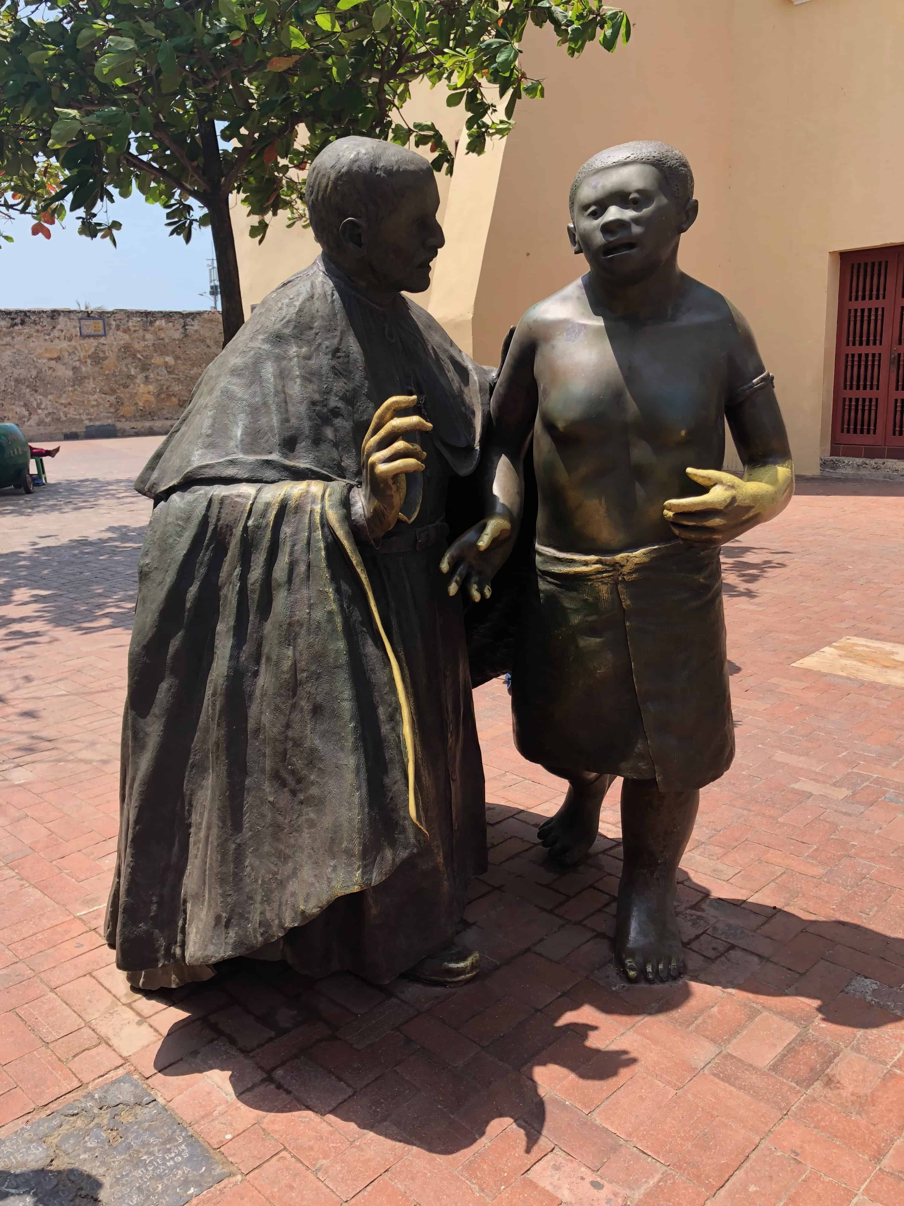 Statue of San Pedro Claver and a young slave boy in Cartagena, Colombia