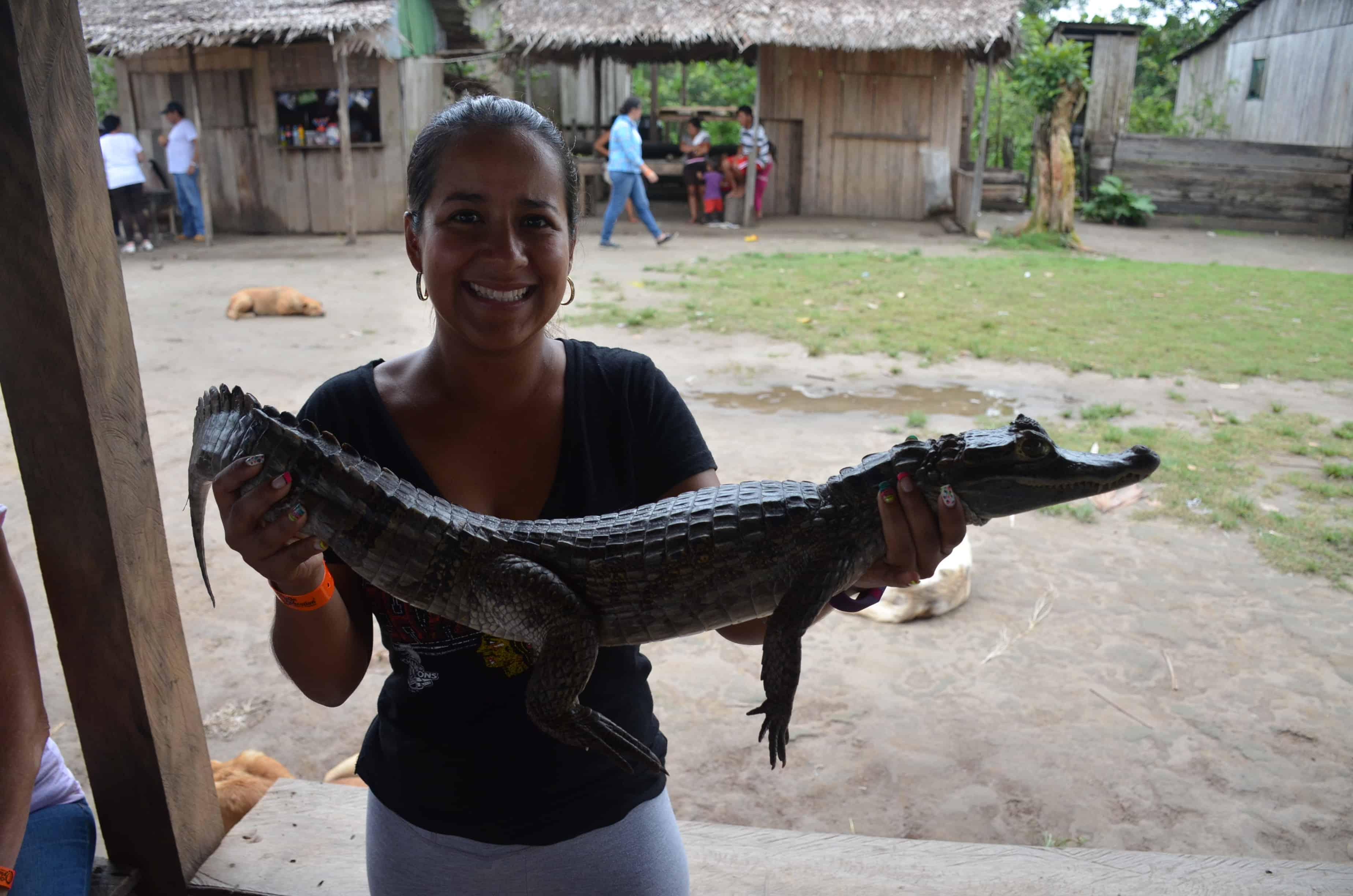 Marisol holding a caiman