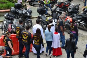 A priest blessing the motorcycles of the Latin American Motorcycle Association
