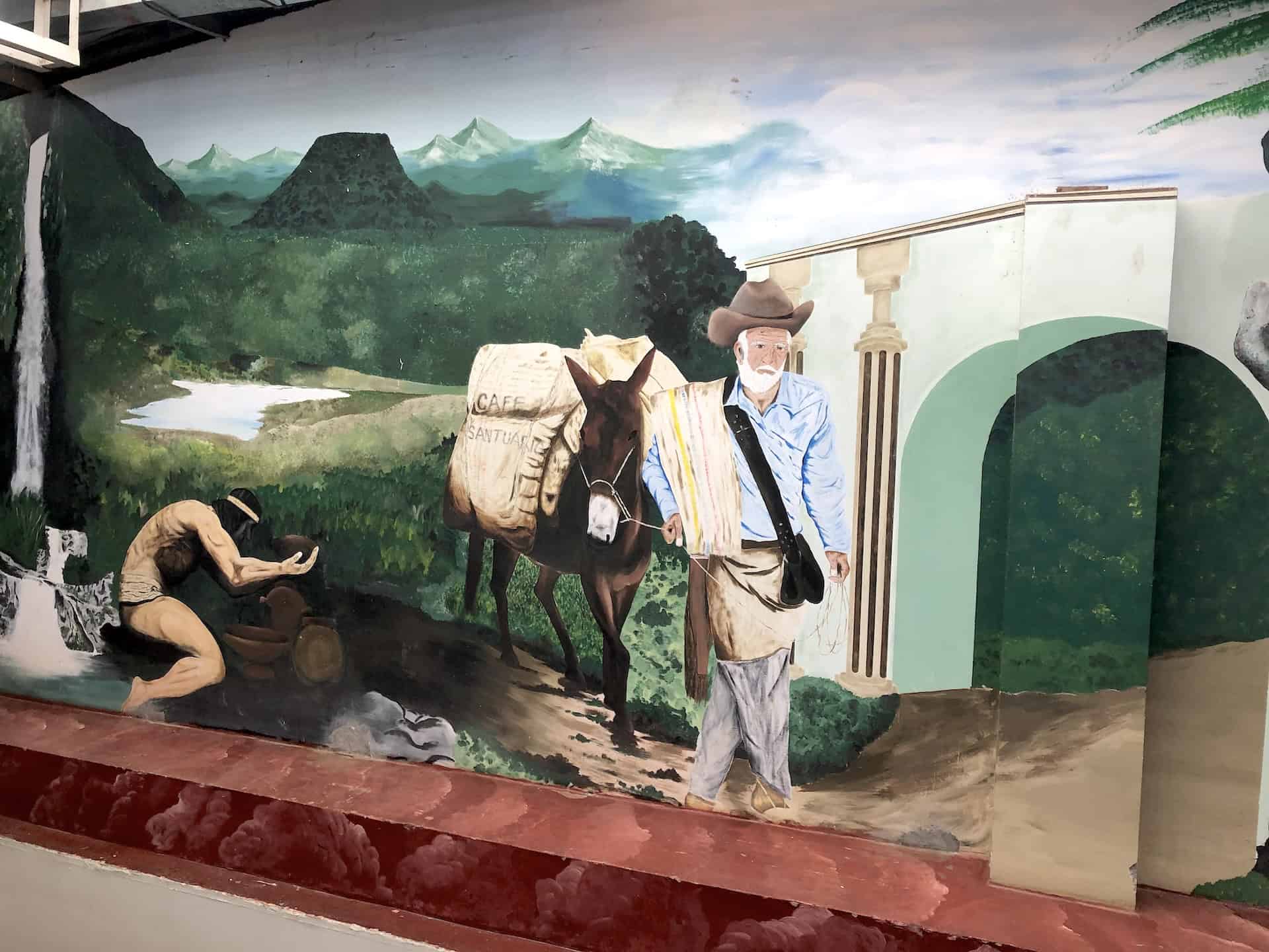 Mural of the agricultural and indigenous history of the town in the Plaza de Mercado