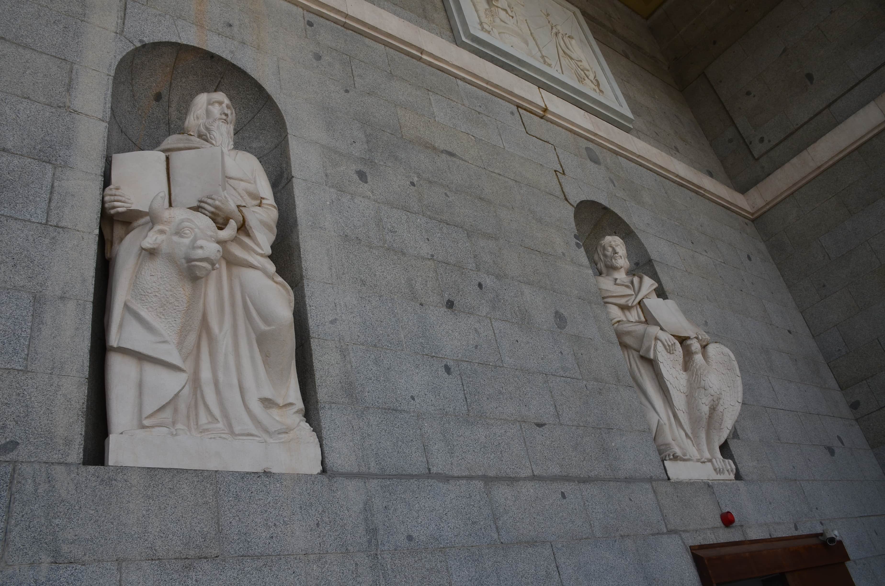 Statues of two Evangelists at the Almudena Cathedral in Madrid, Spain