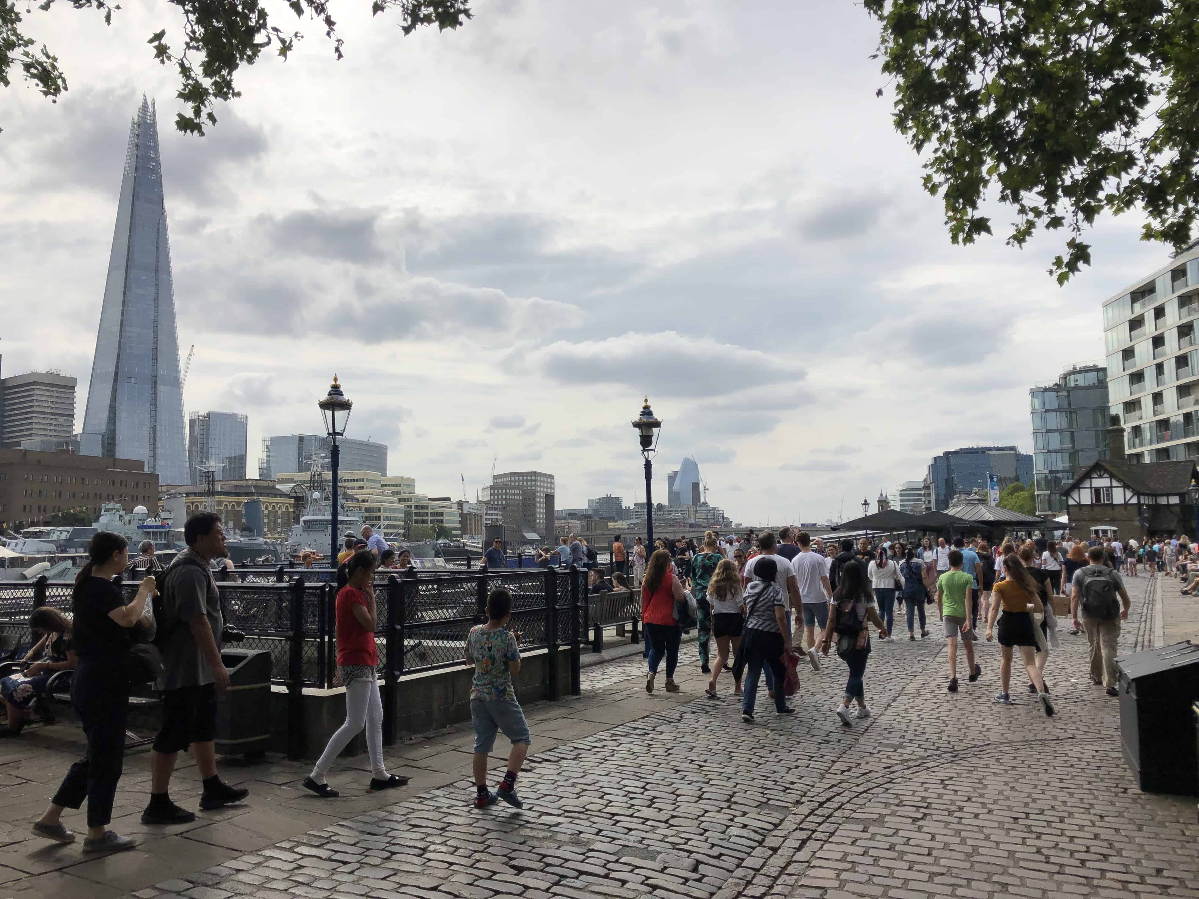 Walking along the wharf outside the Tower of London