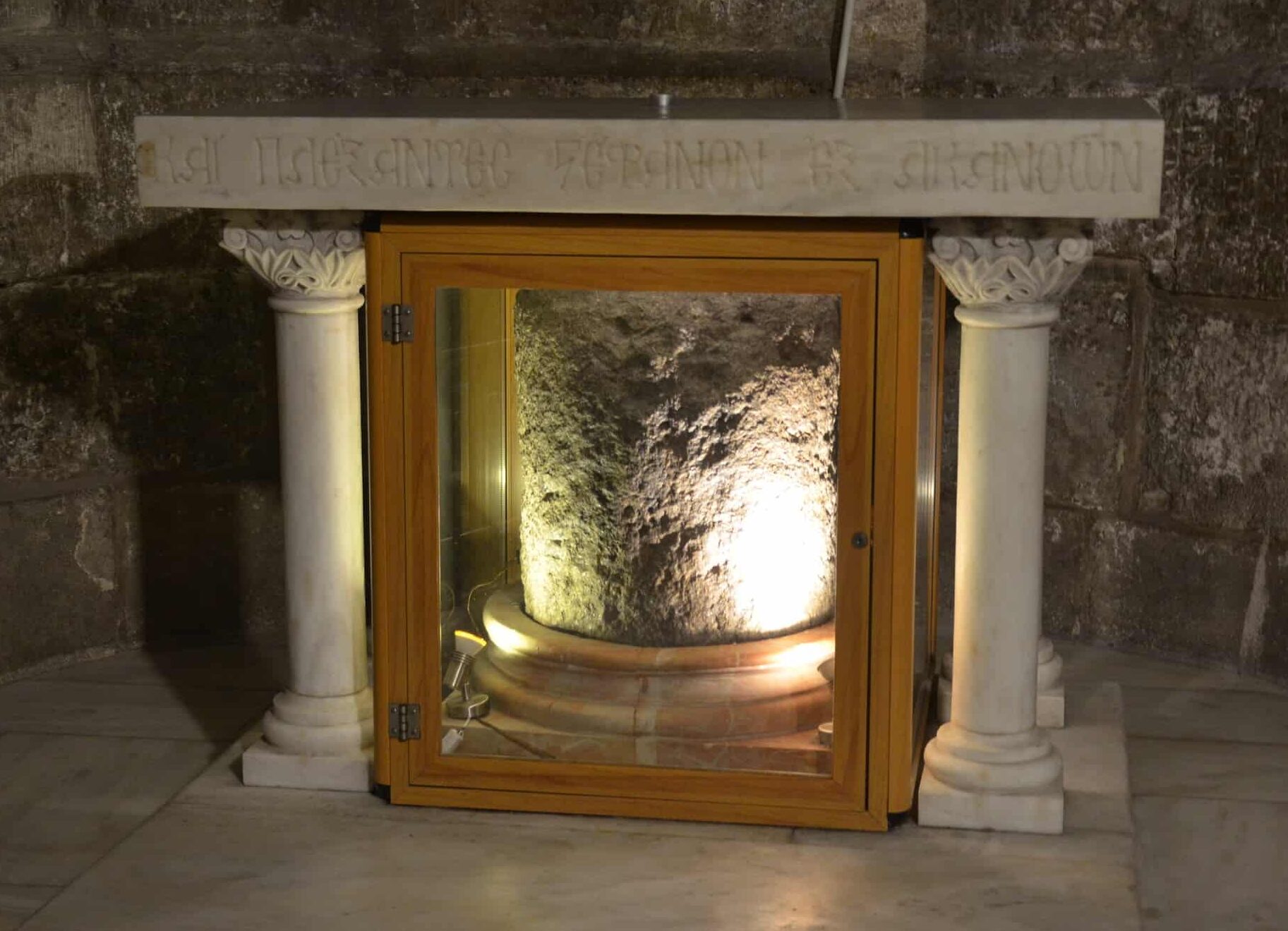 Stone of the Crown of Thorns in the Chapel of the Derision in the ambulatory at the Church of the Holy Sepulchre in Jerusalem