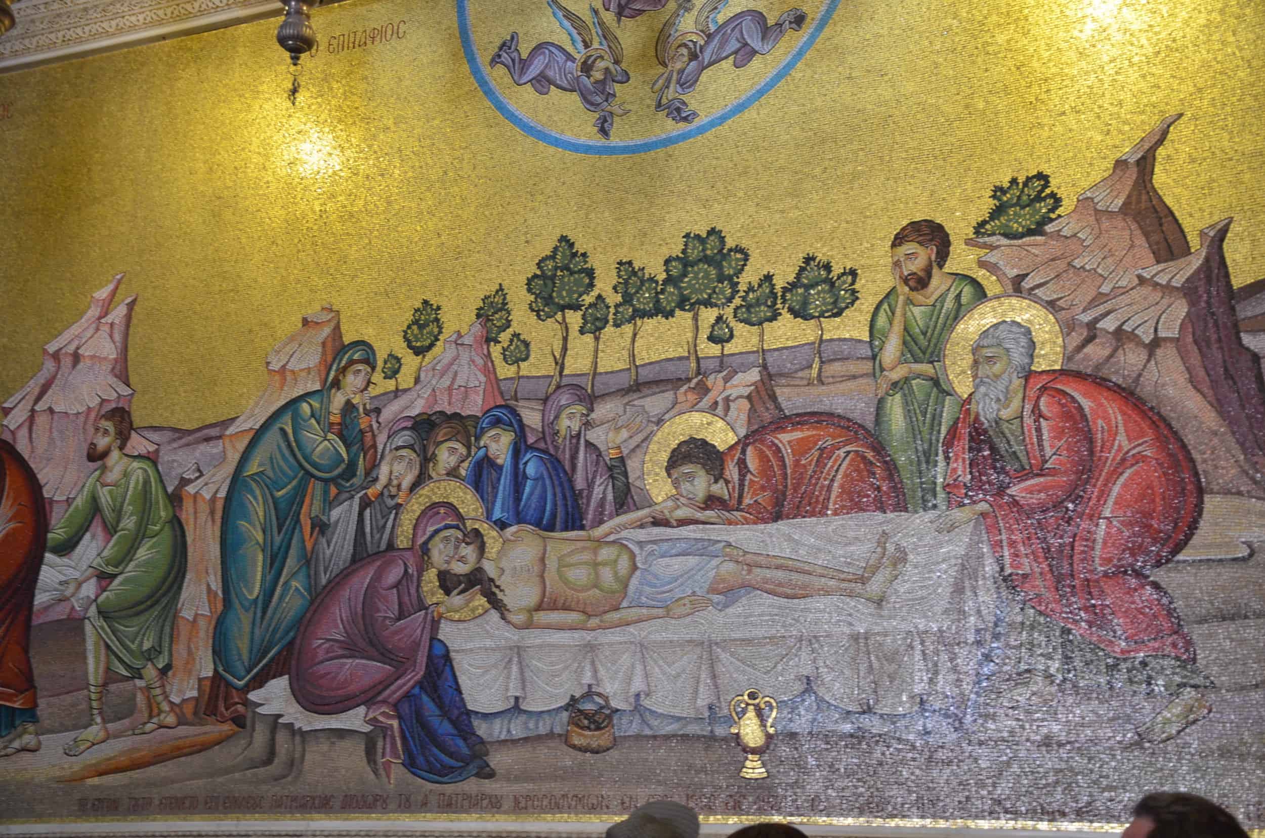 Anointing of Christ mosaic on the wall behind the Stone of Unction