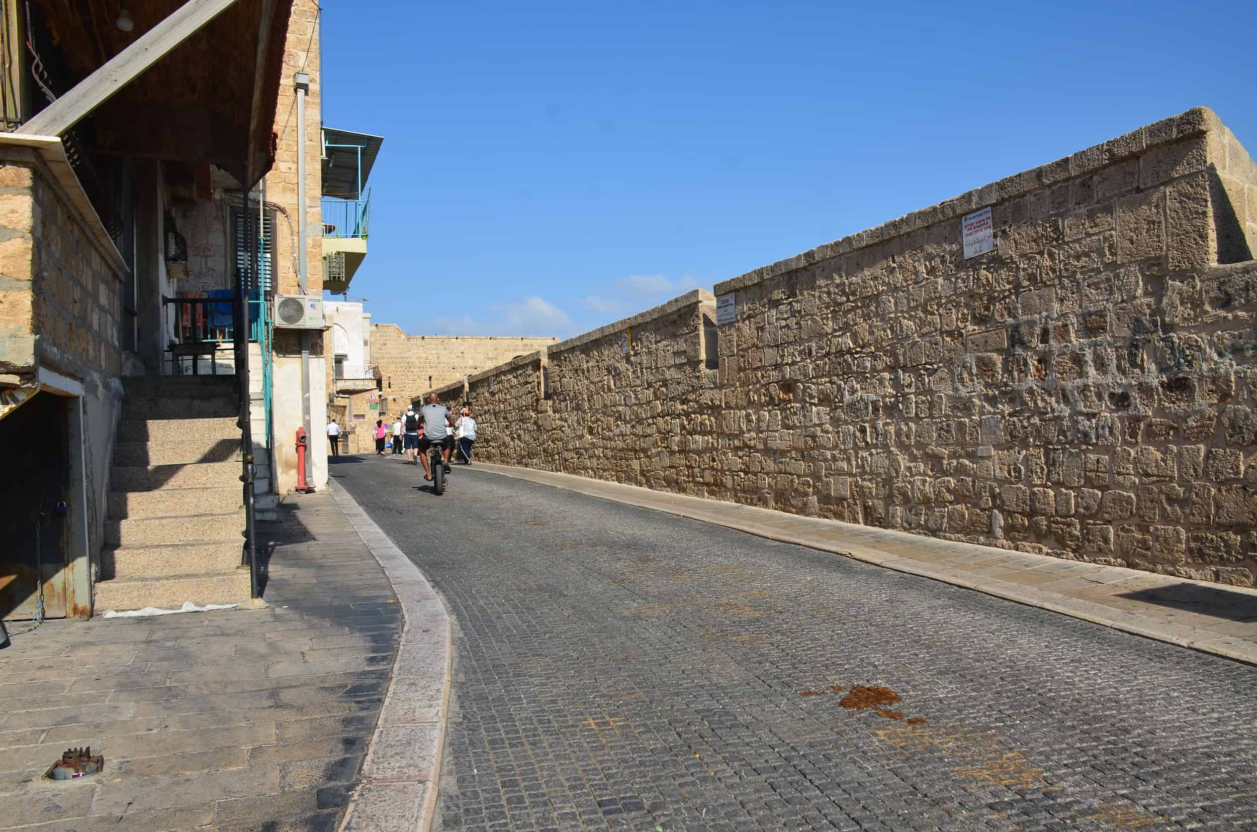 Walking along the sea walls in Acre, Israel