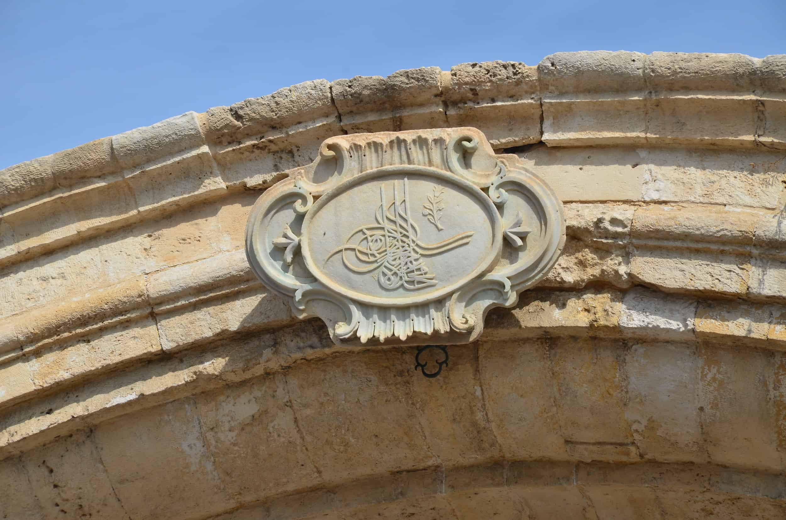 Ottoman tughra above the fountain outside the al-Mahmoudiya Mosque