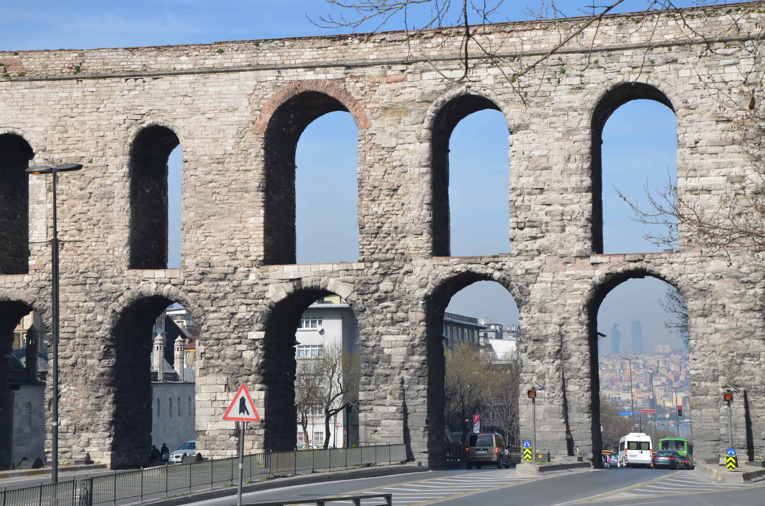 Traffic passing under the Aqueduct of Valens in Saraçhane, Istanbul, Turkey