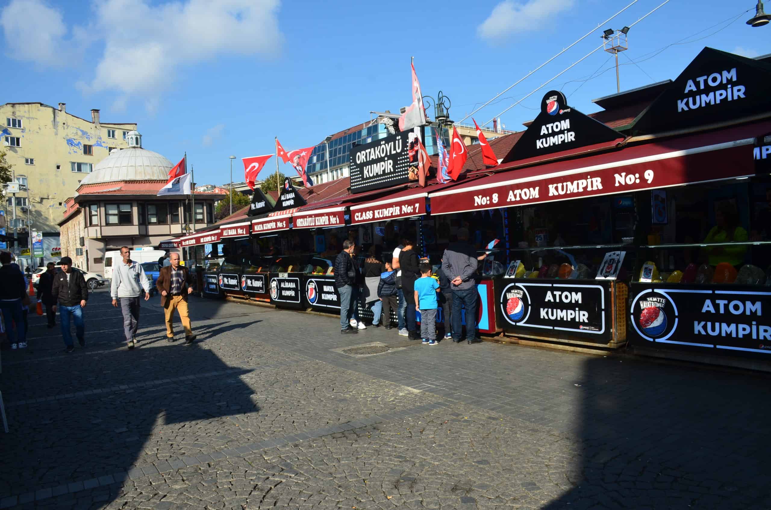 Street lined with kumpir stands in Ortaköy, Beşiktaş, Istanbul, Turkey