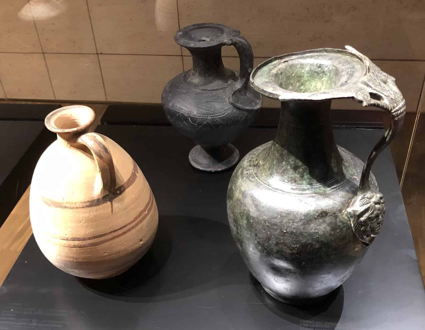 Terracotta wine jug, Hellenistic period (left); bronze wine jug, late Hellenistic to Roman period (right)