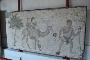 Boys on a camel at the Great Palace Mosaics Museum in Istanbul, Turkey
