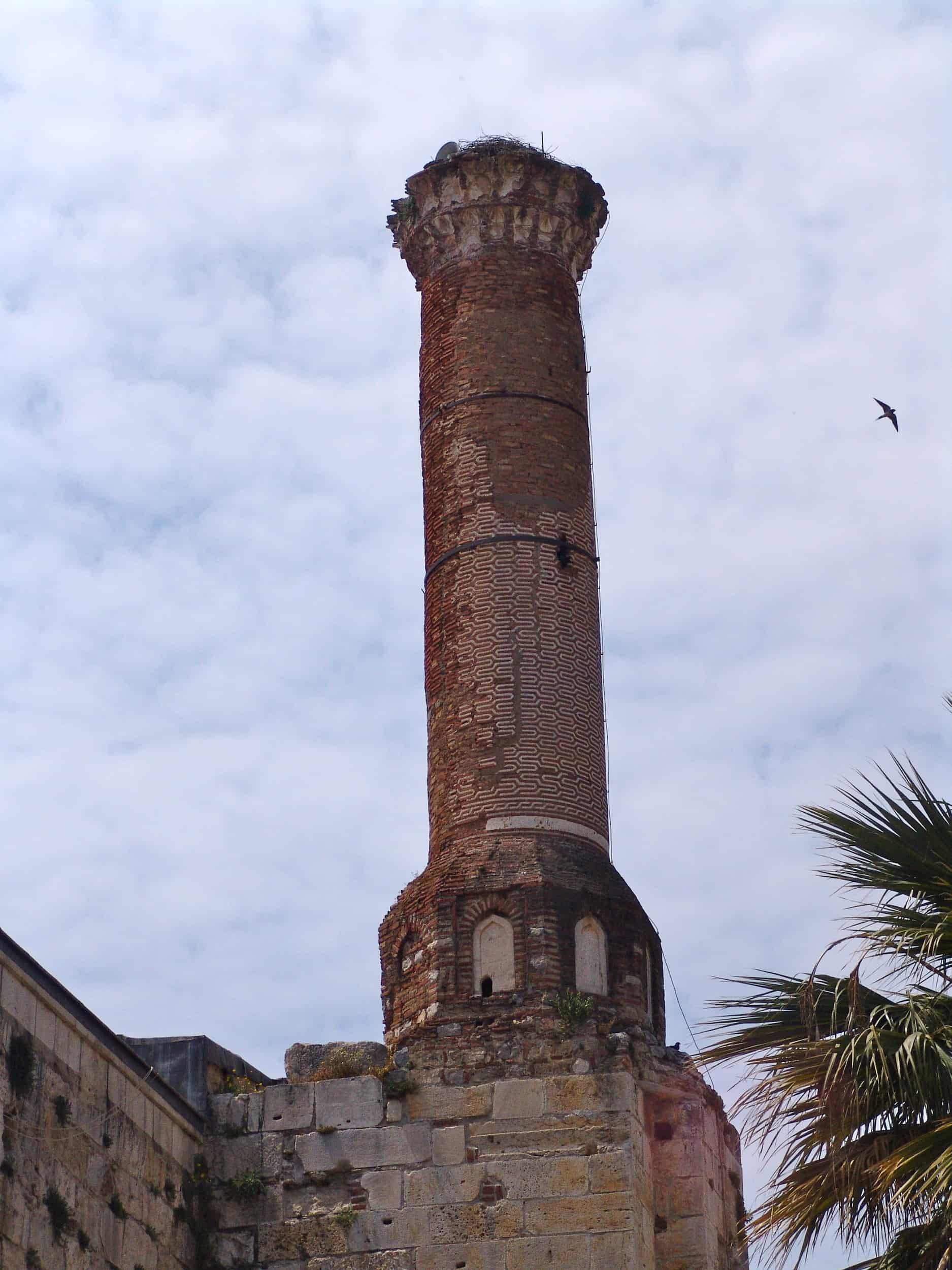 Brick minaret on the west side of the Isa Bey Mosque
