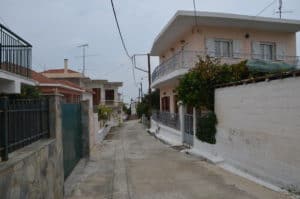 Narrow road through the village in Thalero, Greece
