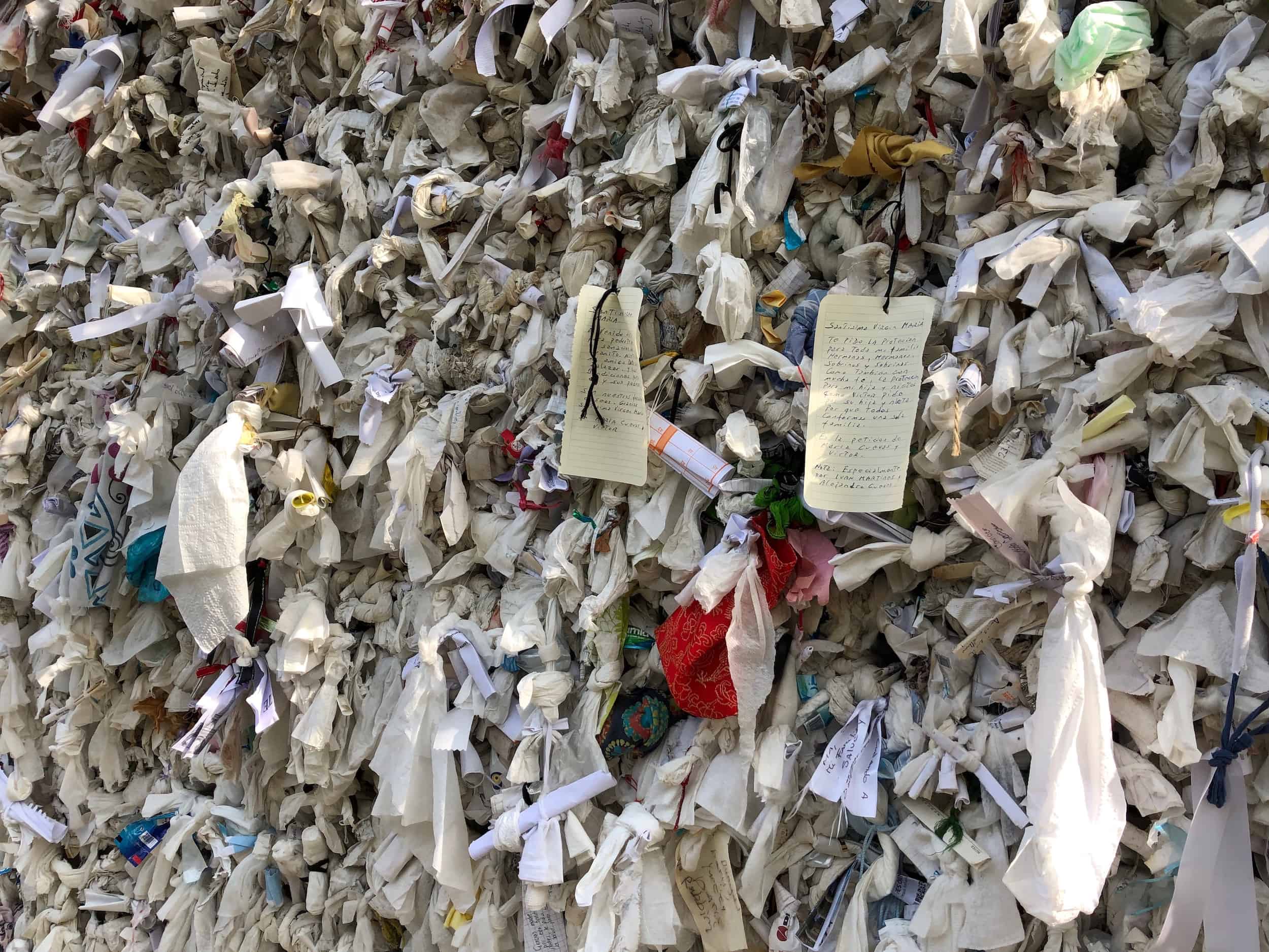 Cloths and prayers tied to the wall at the House of the Virgin Mary in Selçuk, Turkey