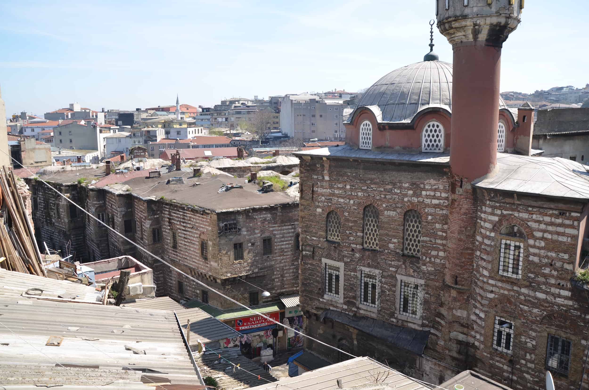 View of Büyük Yeni Han (left) and Mustafa III Mosque (right) at Büyük Valide Han in Istanbul, Turkey