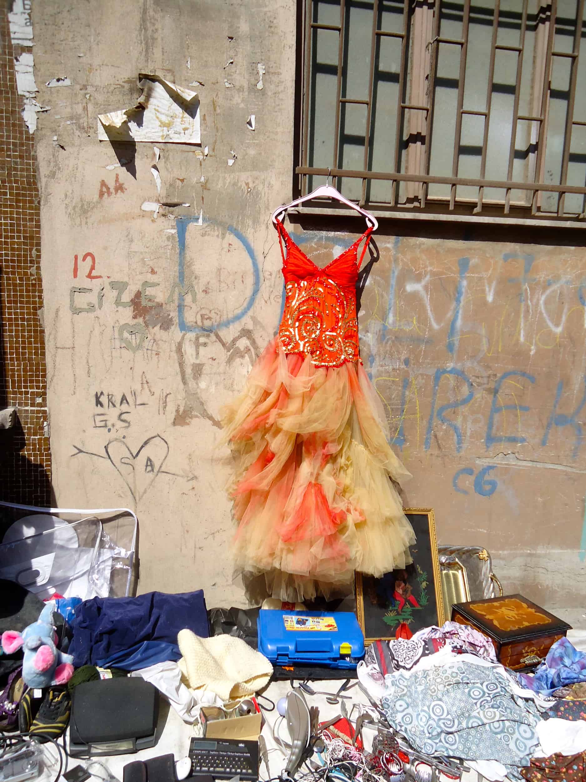 An ugly dress and other junk at the flea market in Dolapdere, Istanbul, Turkey