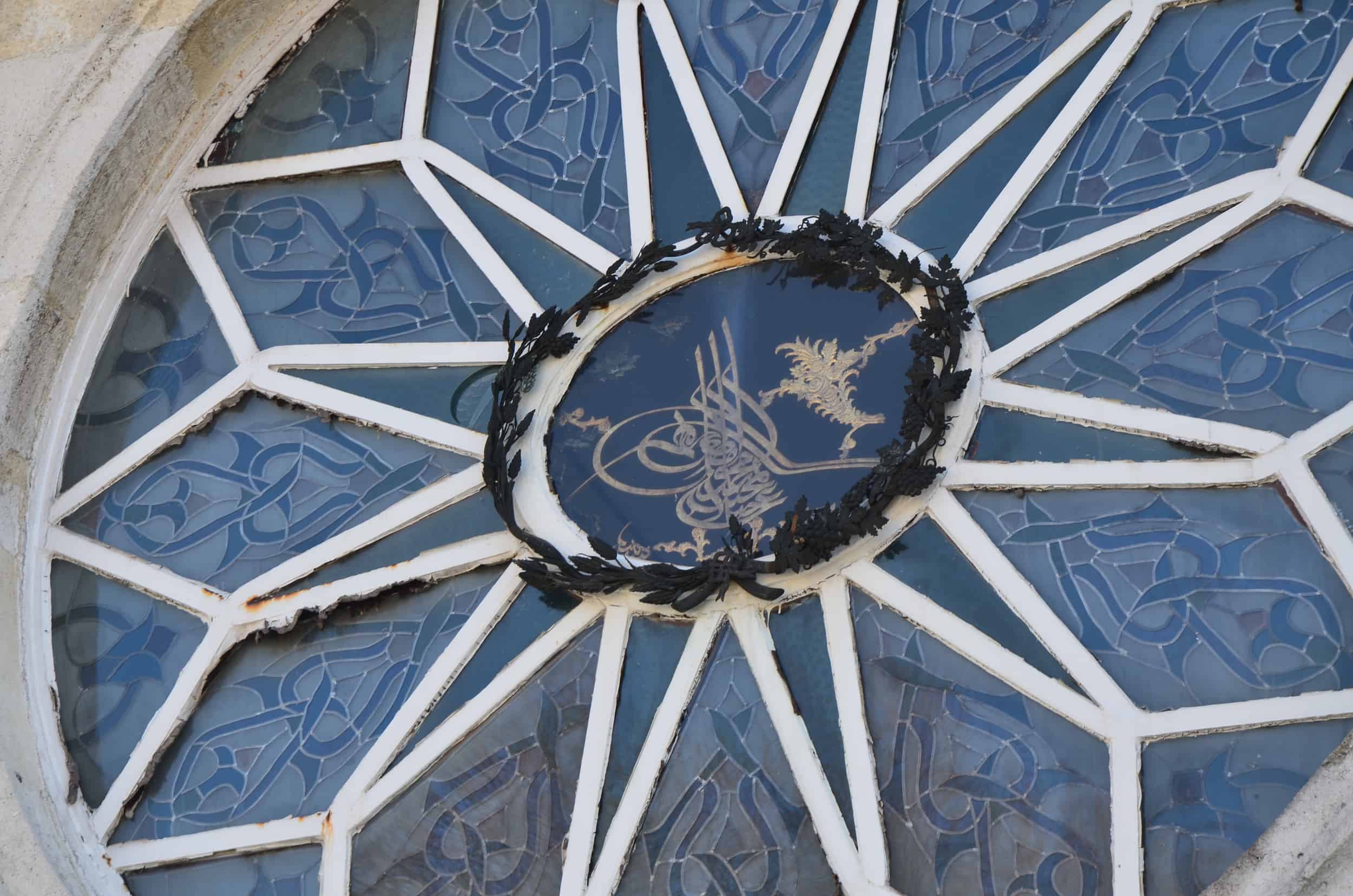 Monogram of Sultan Abdülmecid I on the window above the entrance to the Mosque of the Blessed Mantle