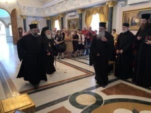 Patriarch Theophilos III walking to his seat in the reception hall of the Greek Orthodox Patriarchate of Jerusalem