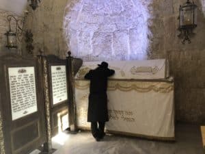 Man praying at King David's Tomb on Mount Zion in Jerusalem