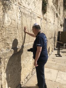 A tourist praying at the Western Wall in Jerusalem