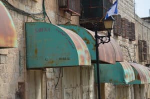 Rusted awning on al-Shuhada Street in Hebron, Palestine