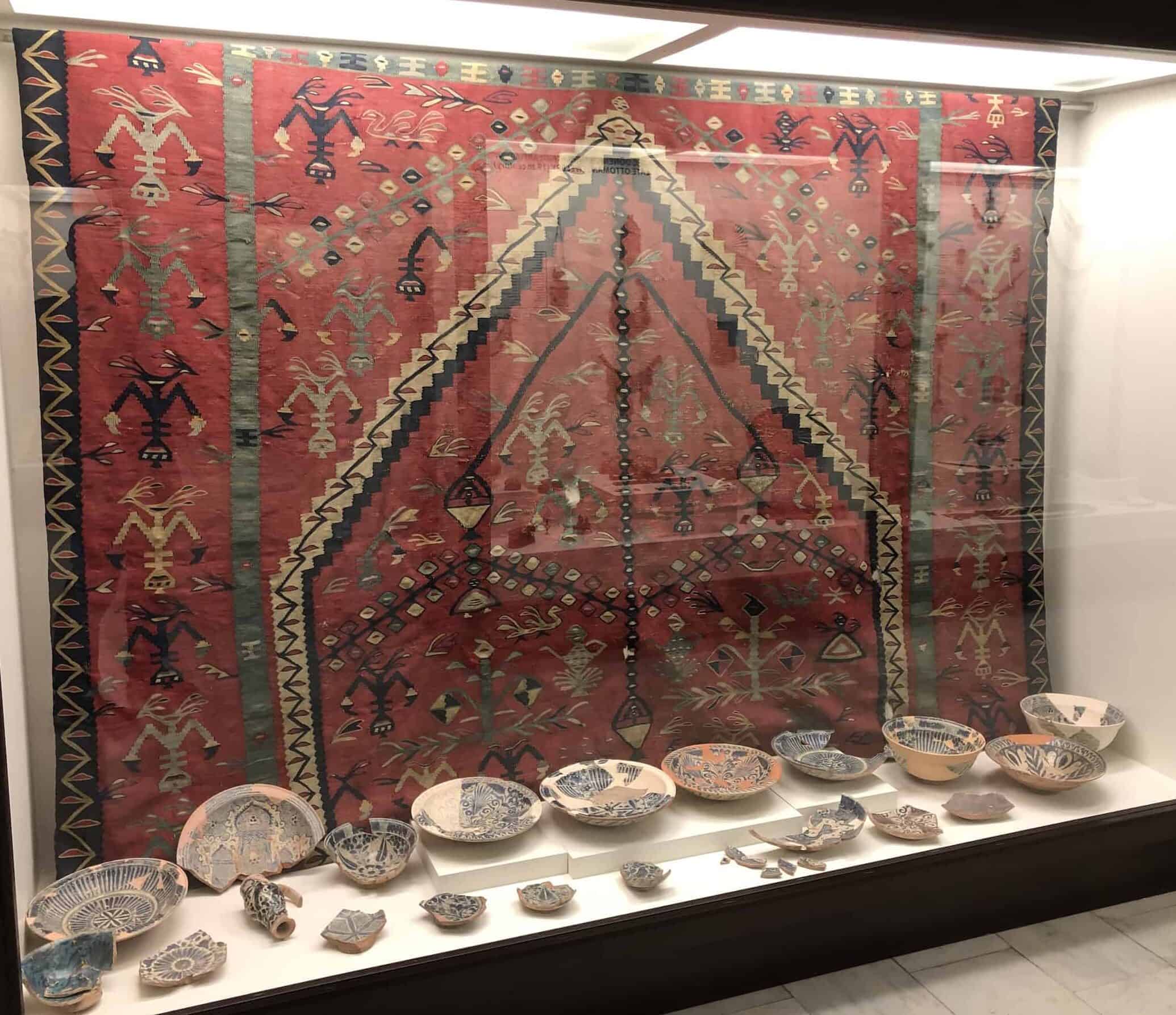 Carpet from Şarköy and ceramic bowls at the Edirne Archaeology and Ethnography Museum in the Edirne historic city center, Turkey