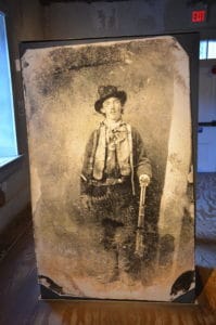 Photo of Billy the Kid at the Old Lincoln County Courthouse at Lincoln Historic Site in New Mexico