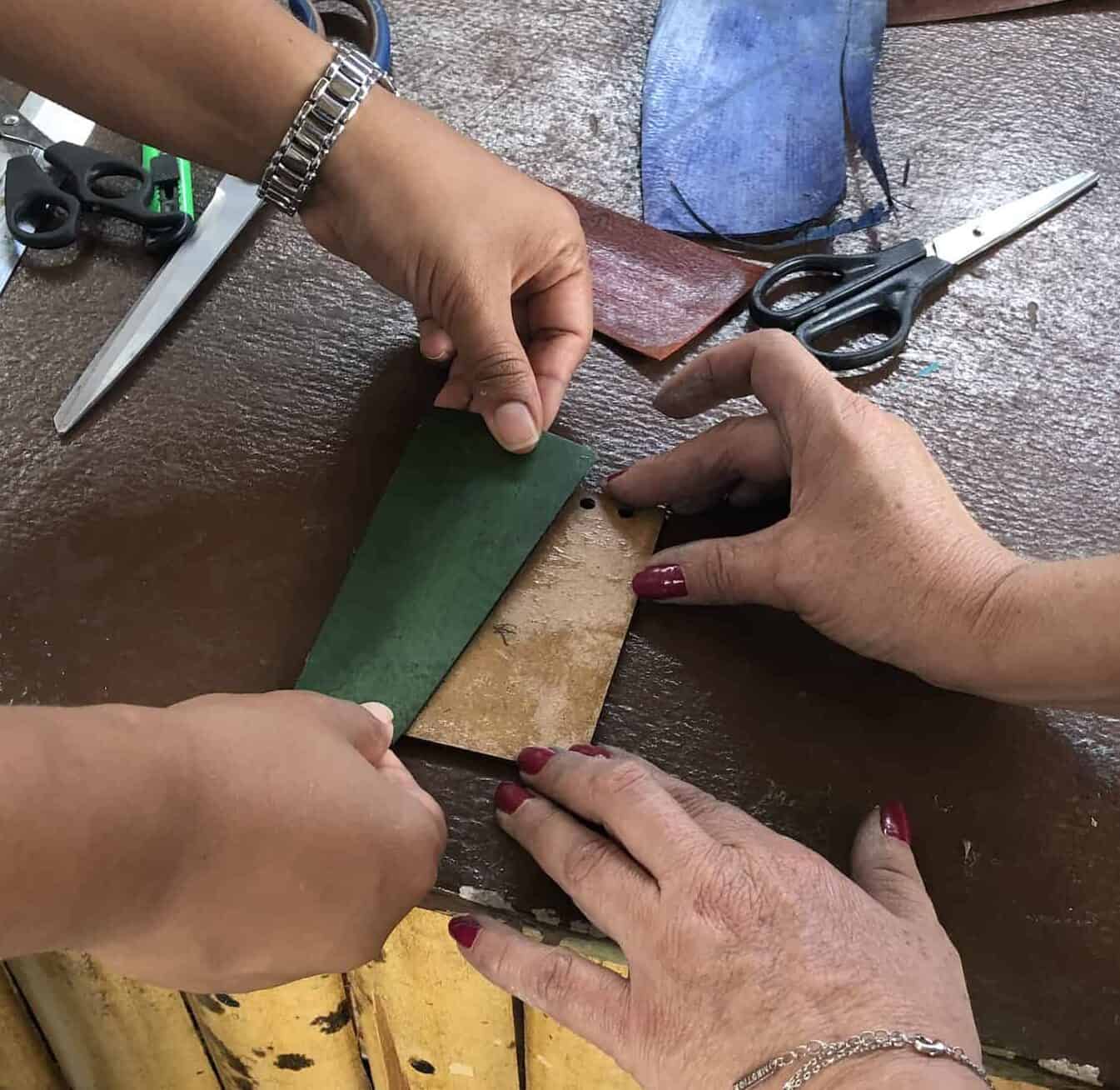 Gluing the pieces onto the wood on the Bamboo and Guadua Educational Hike