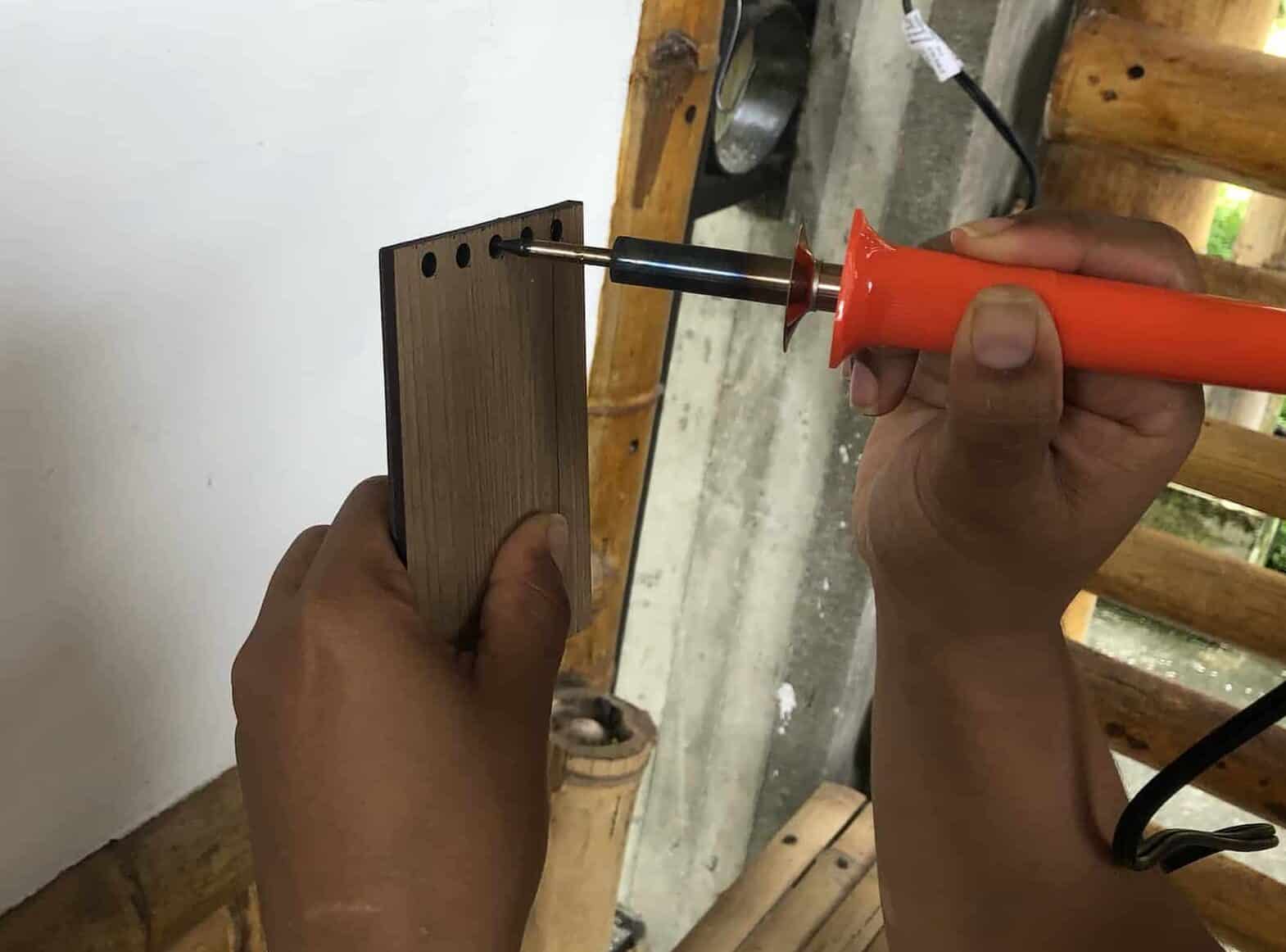 Punching the holes on the Bamboo and Guadua Educational Hike