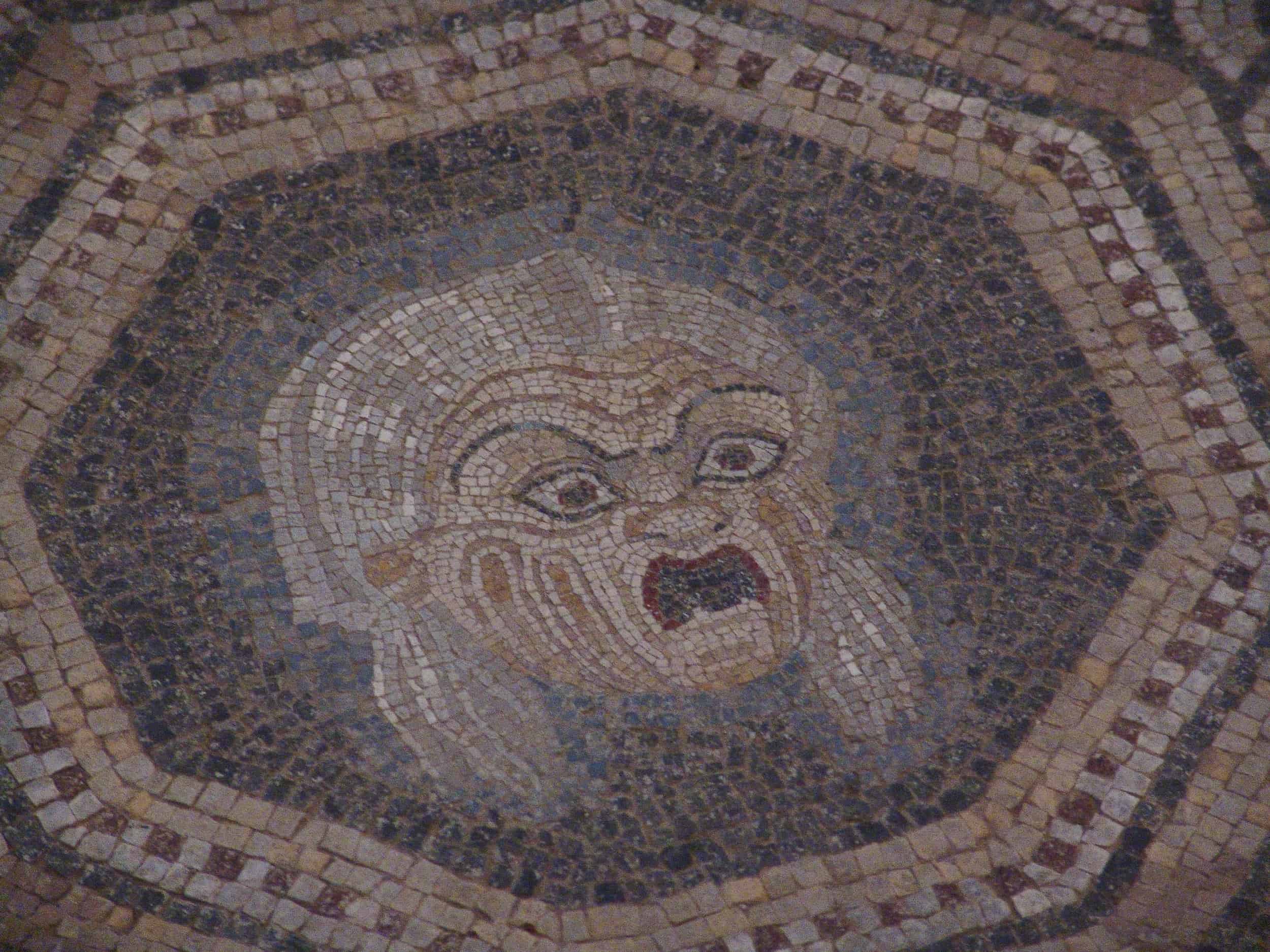 Old woman on a mosaic floor of Building Z
