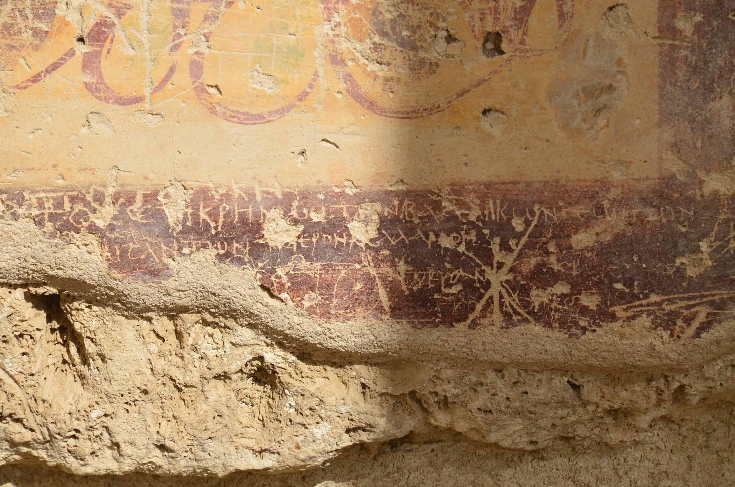 Graffiti and frescoes on the wall of the west portico in the North Agora
