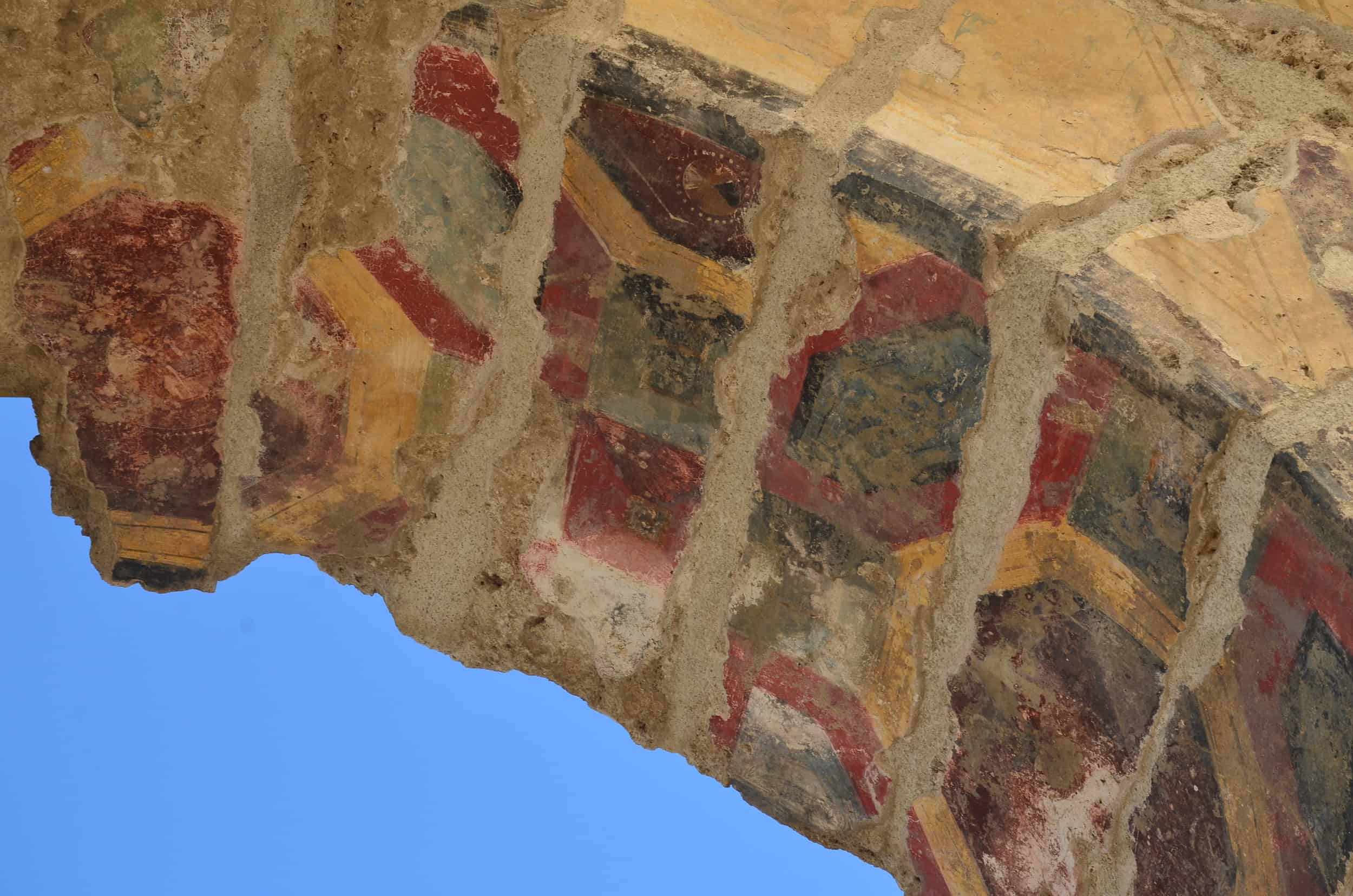 Frescoes under the arch on the wall of the west portico in the North Agora