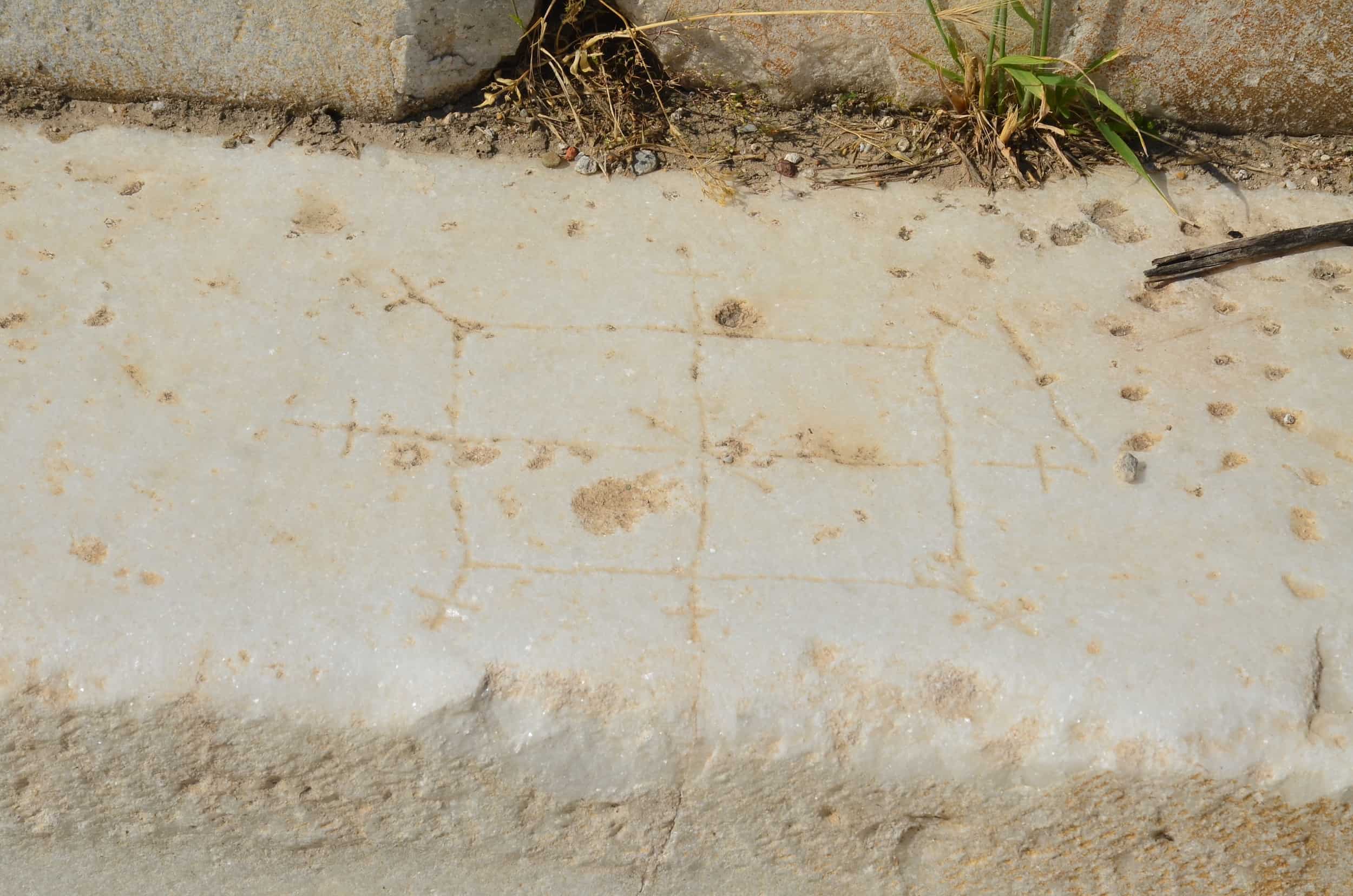 Ancient game in the south portico of the North Agora