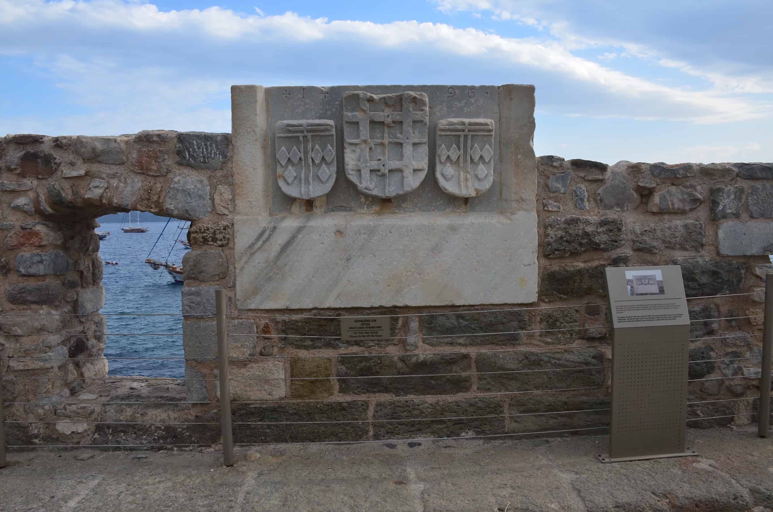 Coats of arms of Nicola da Incisa (left and right) and Pierre d'Aubusson (center)