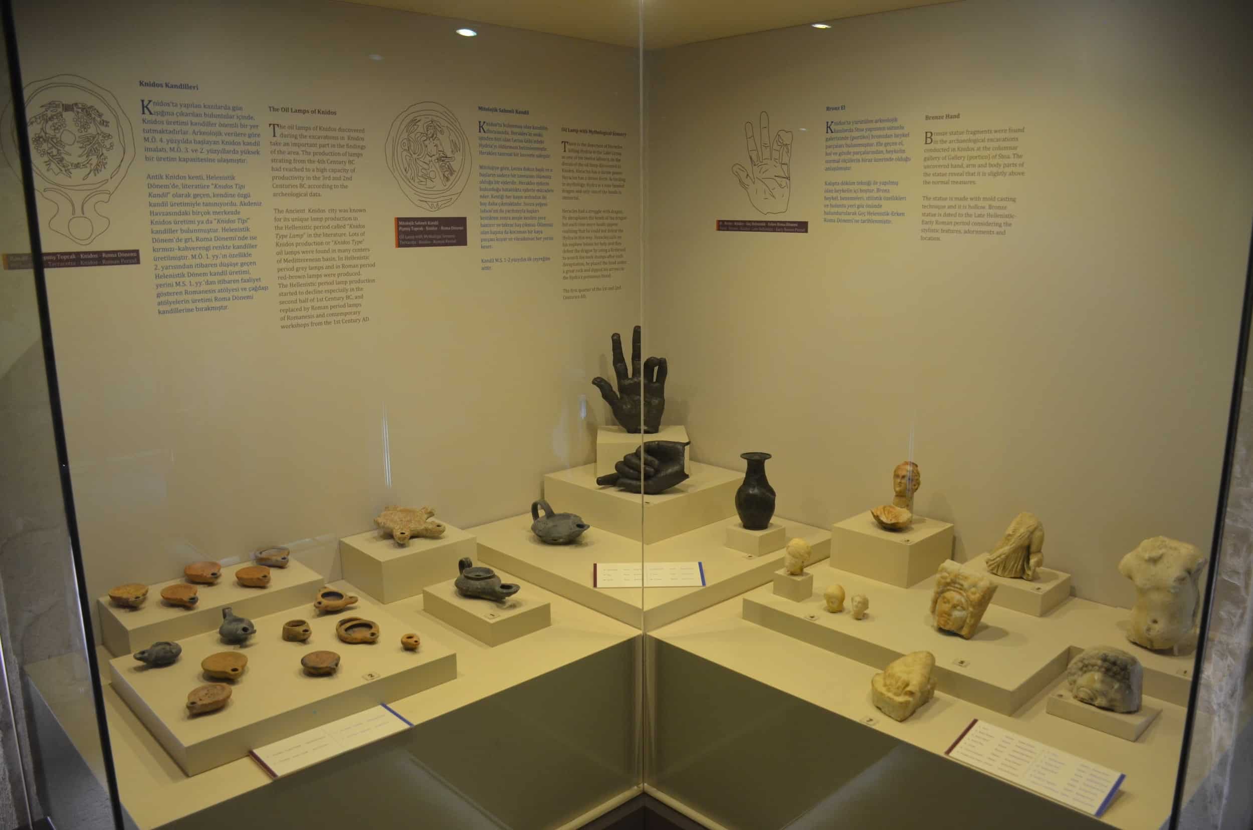 Oil lamps and bronze hands in the Knidos Hall at the Marmaris Museum