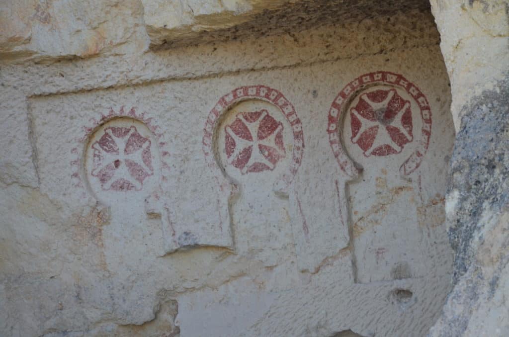 Maltese crosses above the entrance to the refectory of the Sandal Church