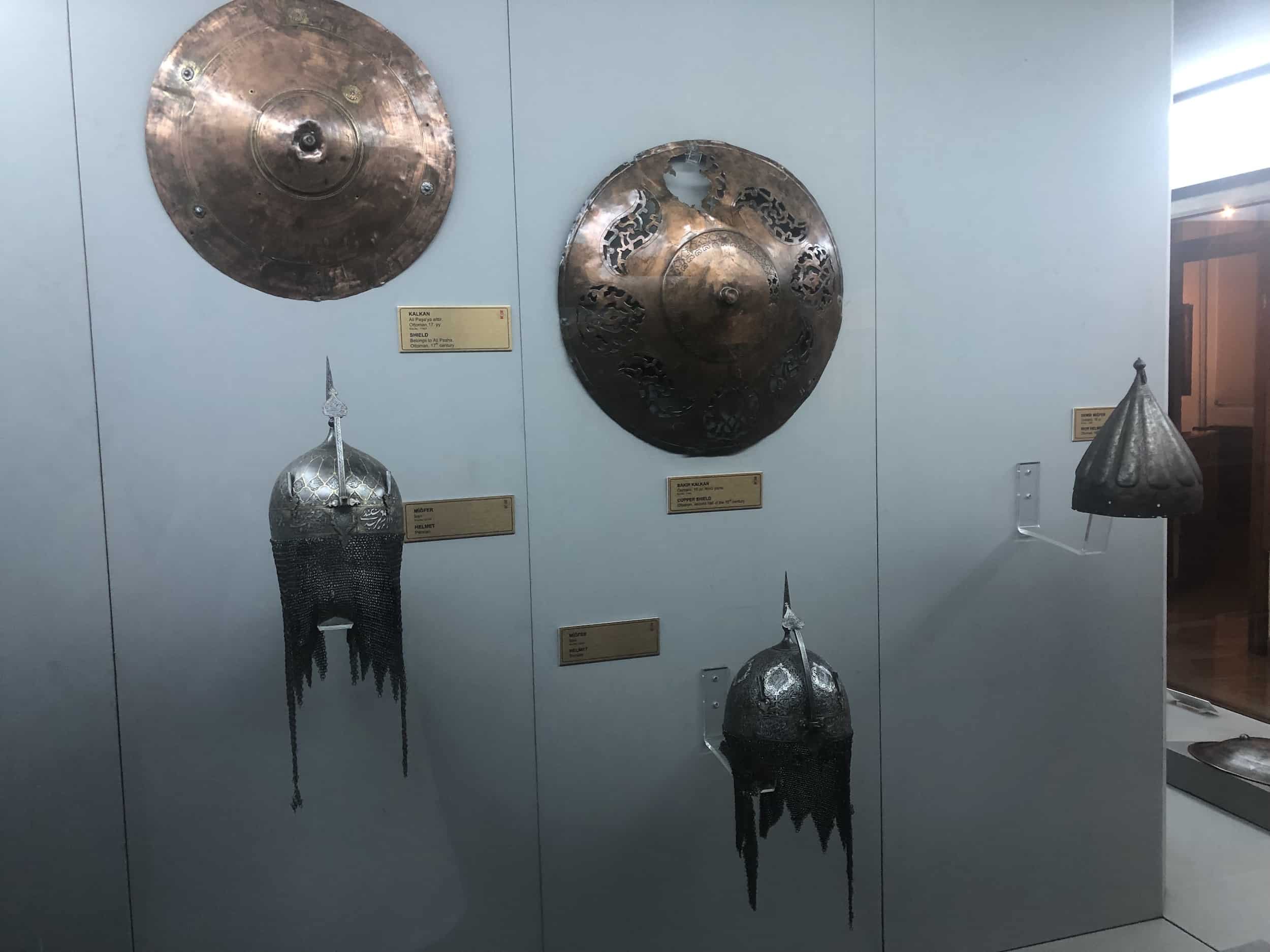 Persian helmets and Ottoman shields in Defence Weapons Hall 2 at the Harbiye Military Museum in Istanbul, Turkey