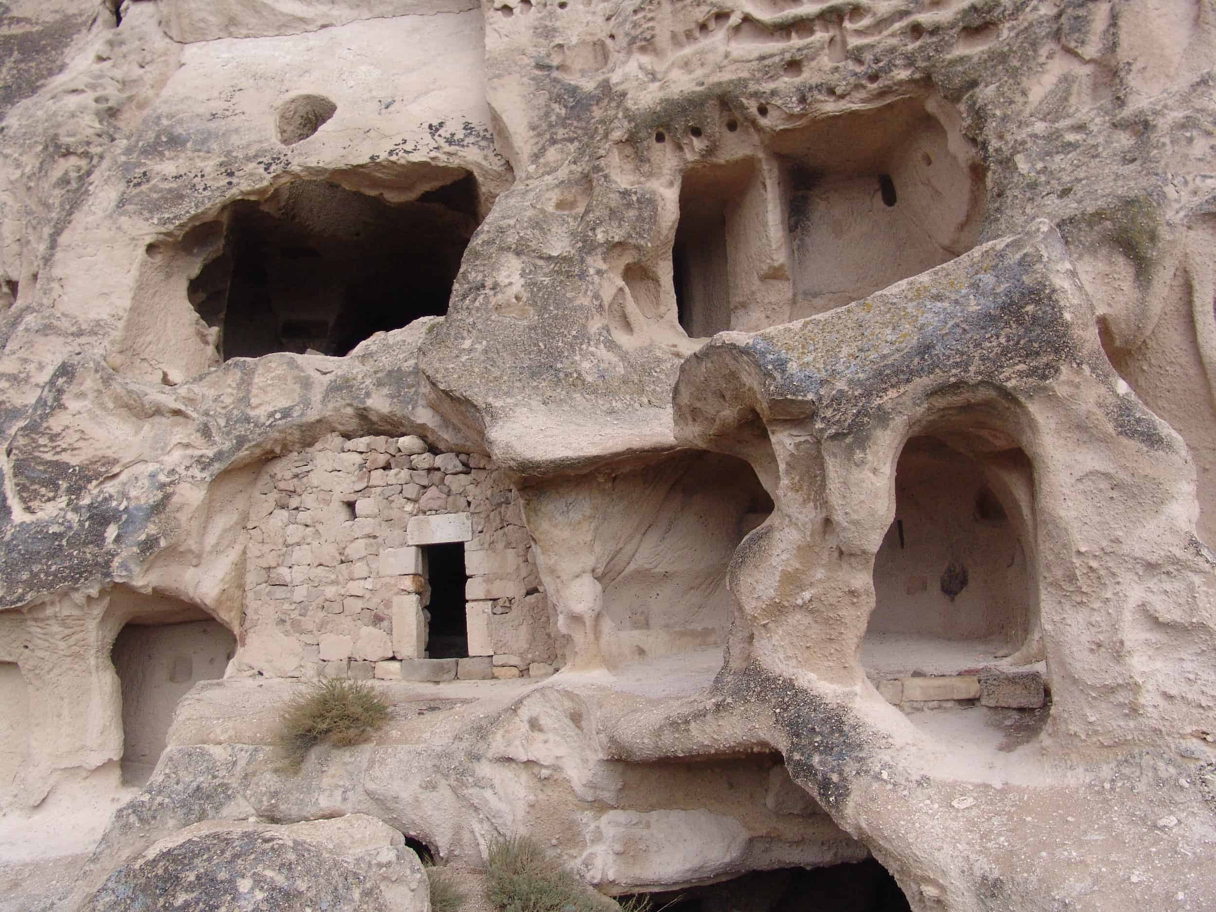 Homes cut into Üçhisar Castle in Cappadocia, Turkey