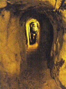 Walking through a tunnel at the Derinkuyu Underground City in Cappadocia, Turkey