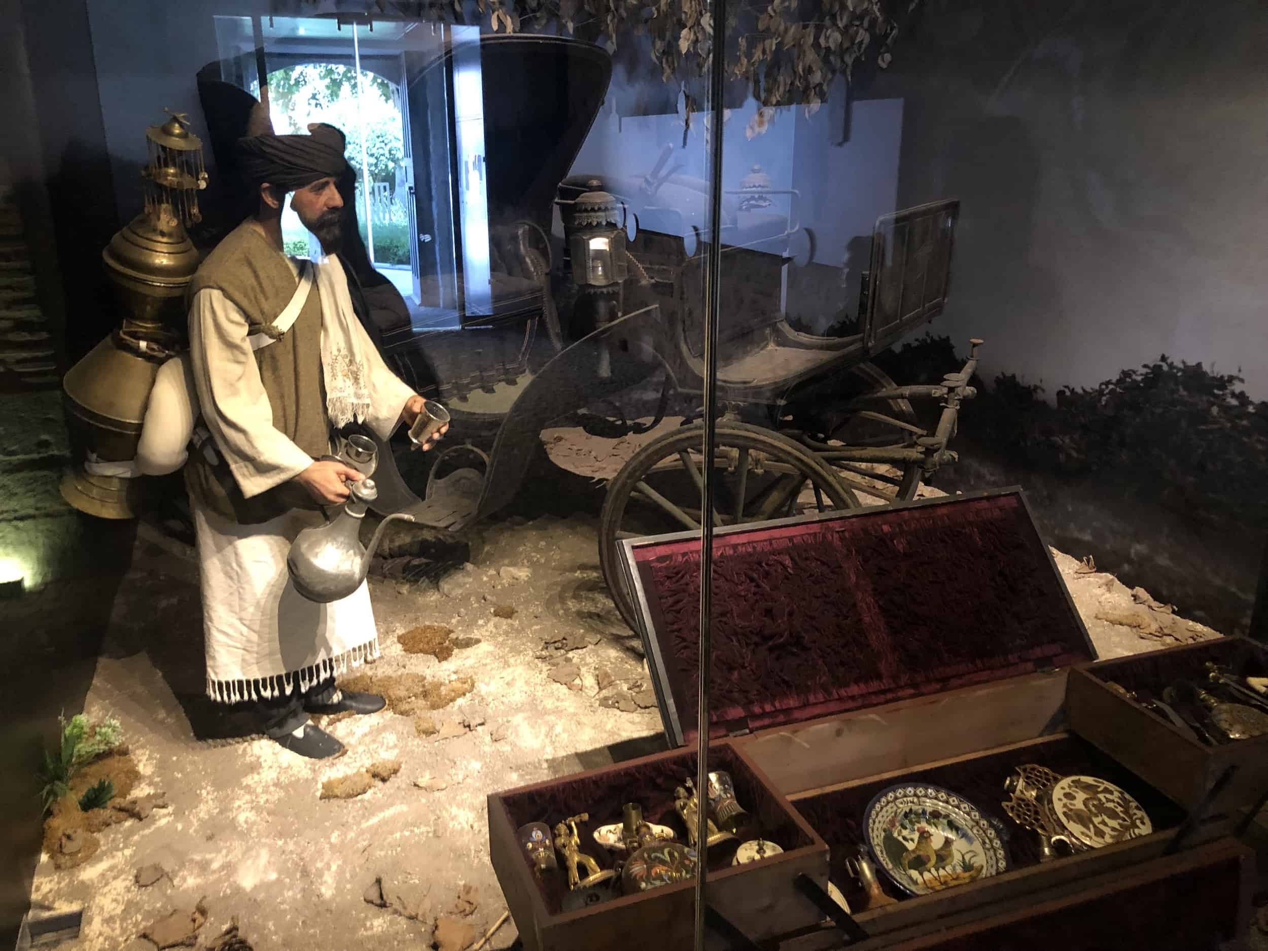 Street vendor selling coffee in the ethnographic collection at the Museum of Turkish and Islamic Arts in Istanbul, Turkey