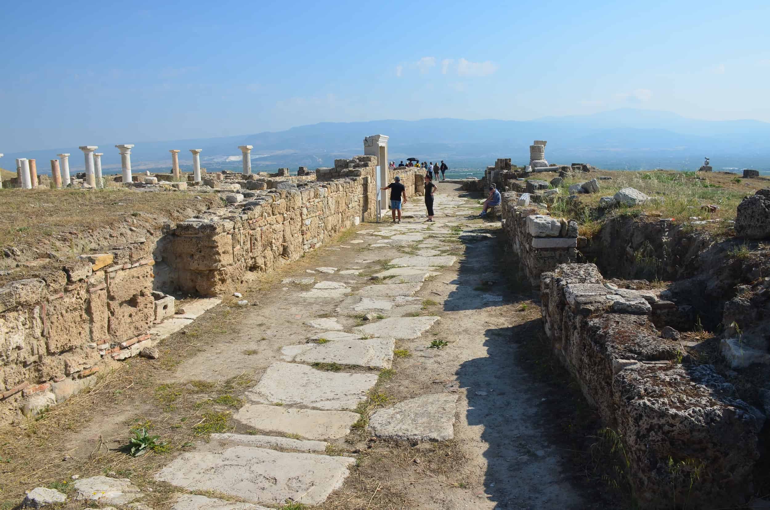 Walking north to the Peristyle House with Church