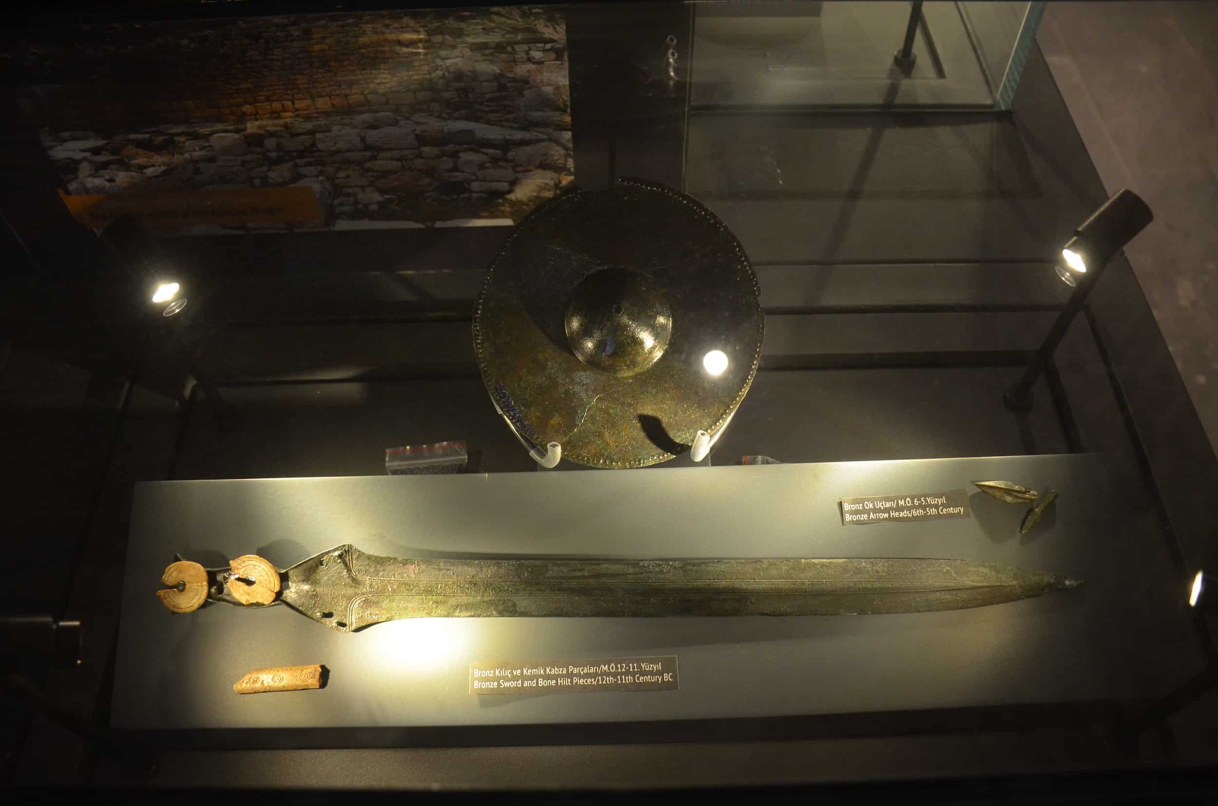 Bronze sword and bone hilt pieces (12th-11th century BC); bronze arrowheads (6th-5th century BC) in the Pedasa Antique City Exhibition at Bodrum Castle in Turkey