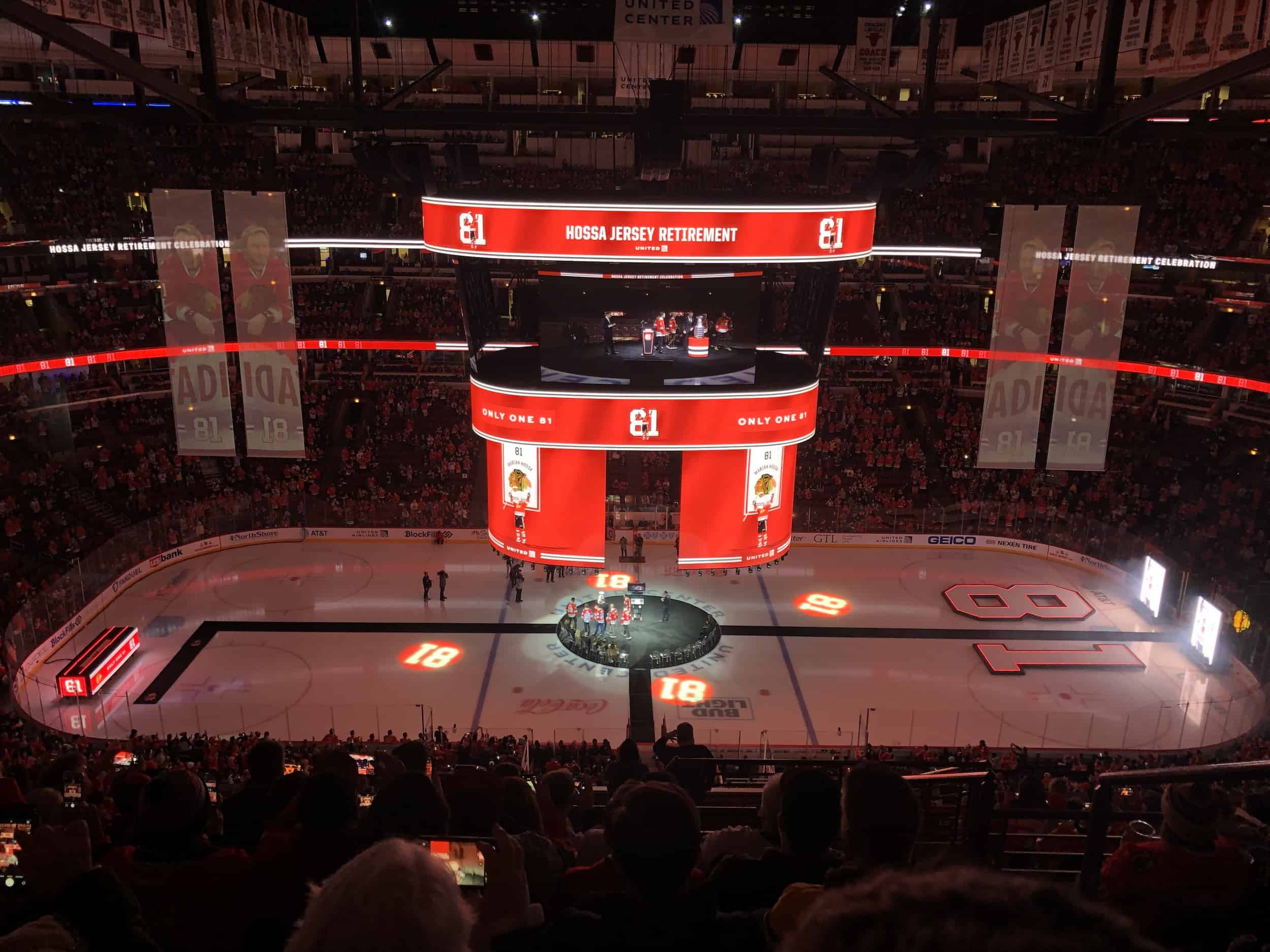 Hossa and his former teammates taking a picture with the Stanley Cup during the Marian Hossa jersey retirement ceremony at the United Center in Chicago, Illinois