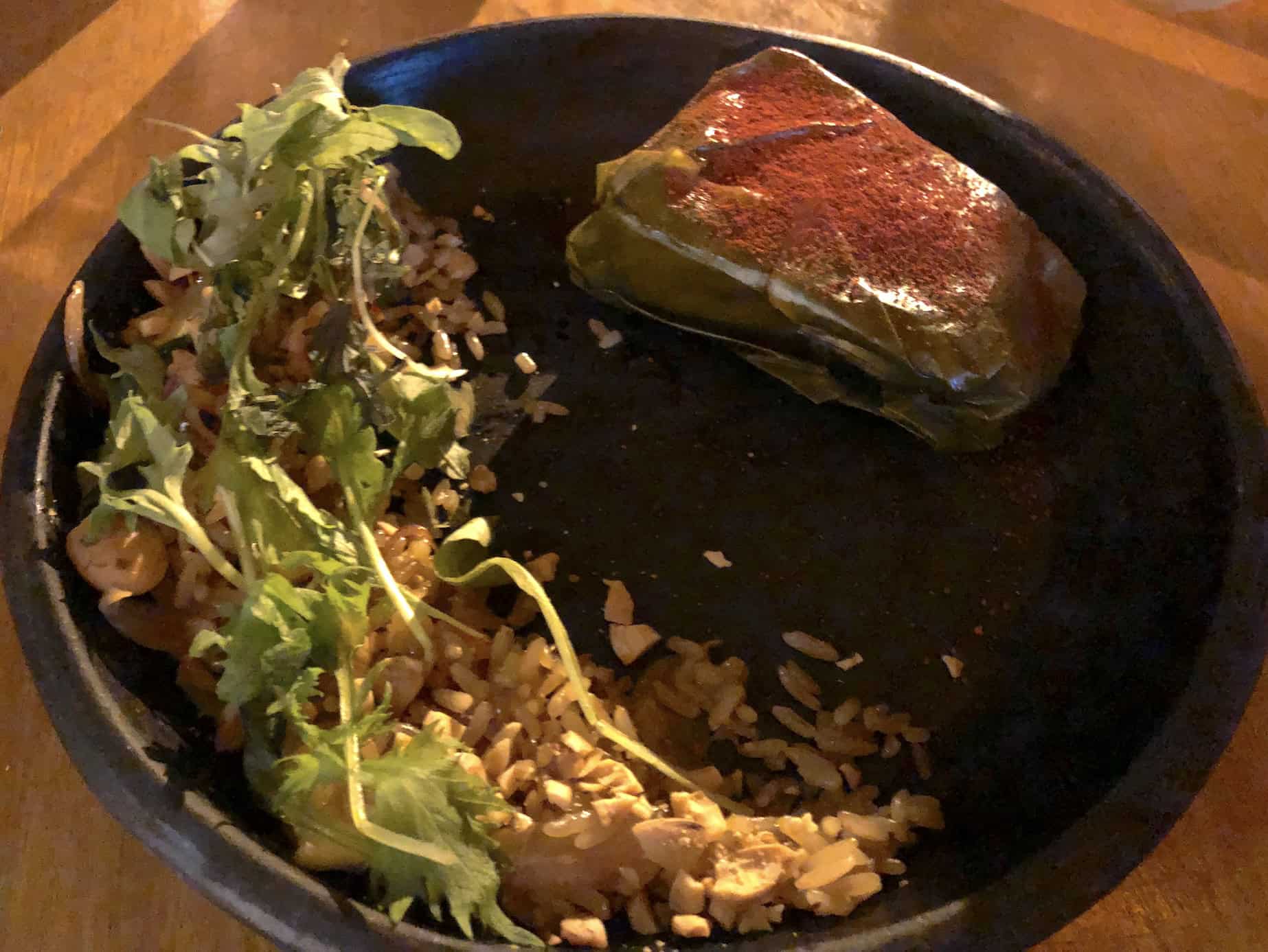 Filet of pirarucú wrapped in a leaf at La Chagra in El Poblado, Medellín, Antioquia, Colombia