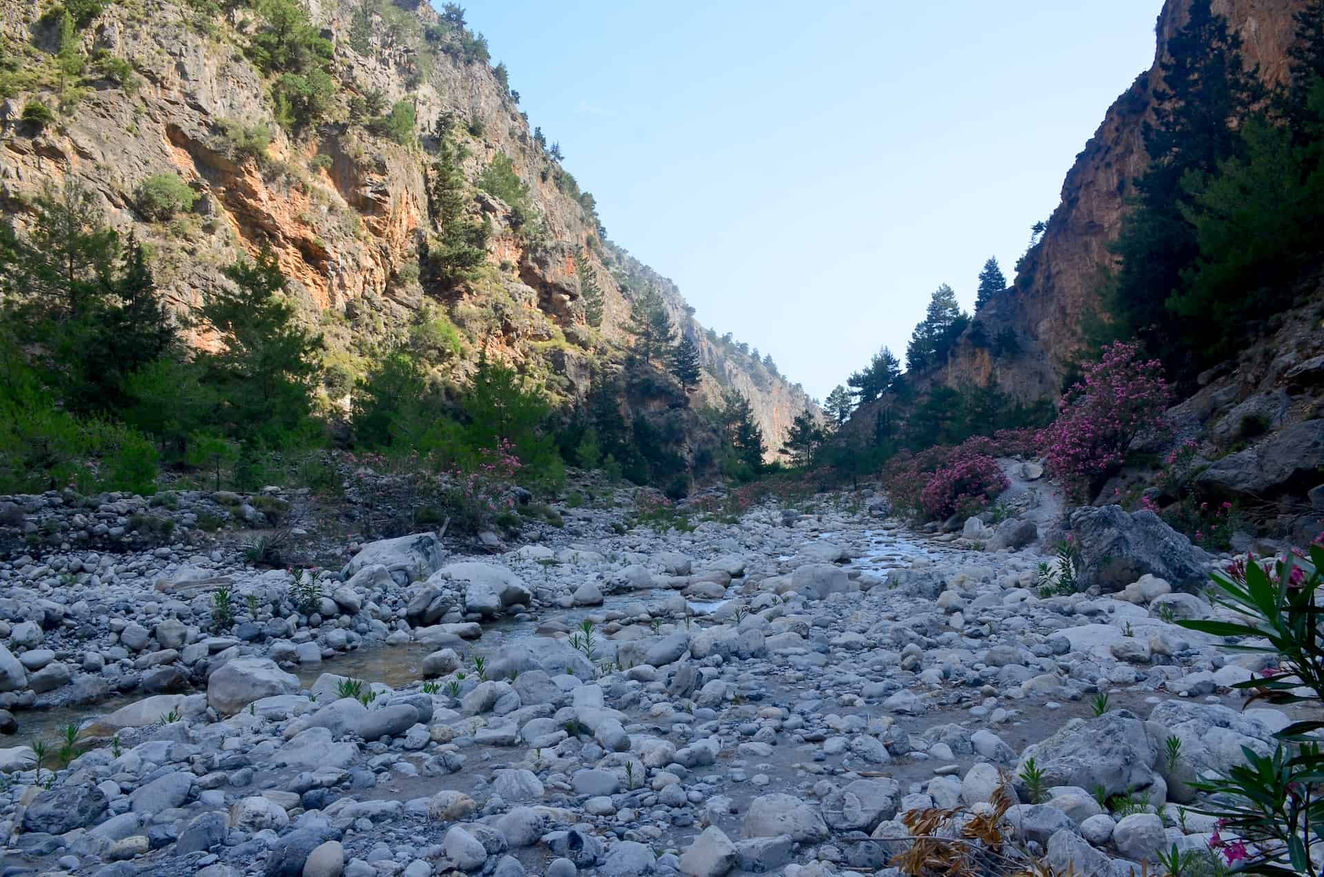 Hiking along the riverbed at the Samaria Gorge in Crete, Greece