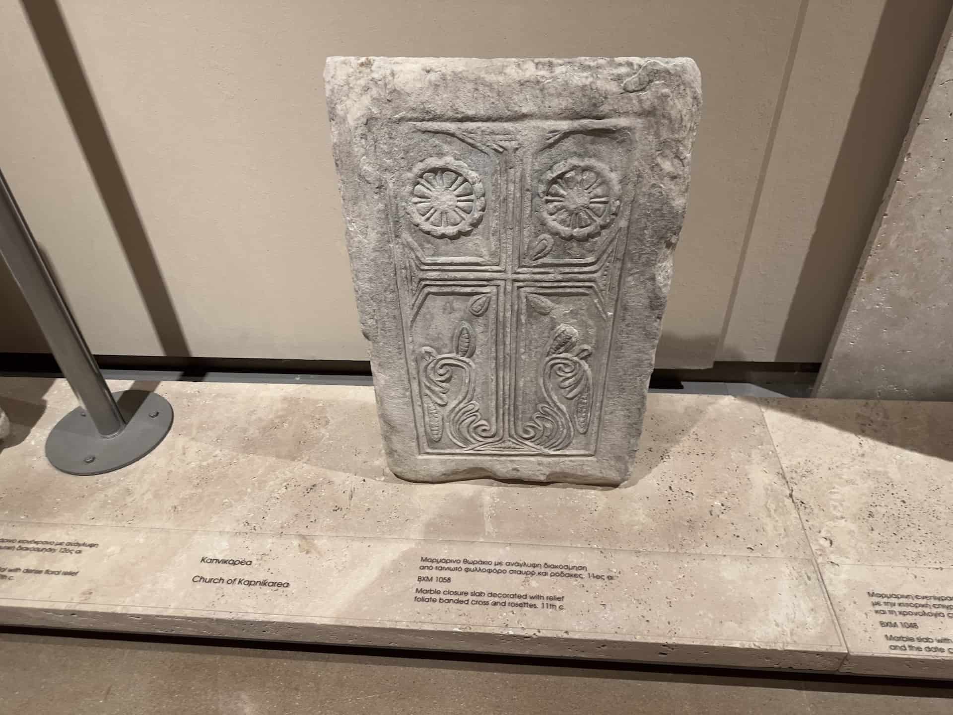 Marble closure slab decorated with relief foliate banded cross and rosettes, Kapnikarea Church, 11th century at the Byzantine Museum in Athens, Greece