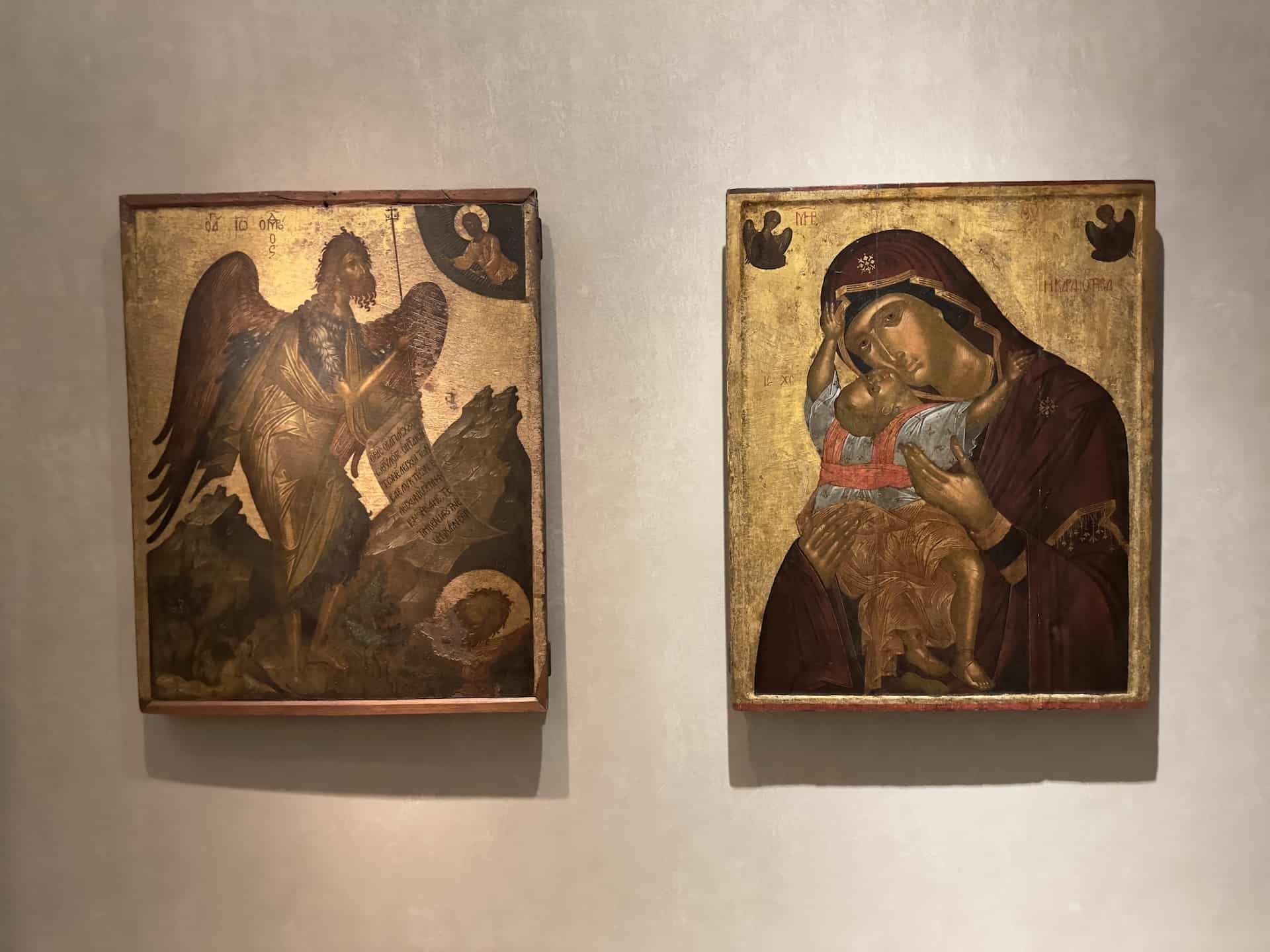 Icon with Saint John the Baptist (left) and Icon with the Virgin of Tenderness (Glykophilousa/Kardiotissa) (right), both painted by Angelos Akotantos, first half of the 15th century at the Byzantine Museum in Athens, Greece