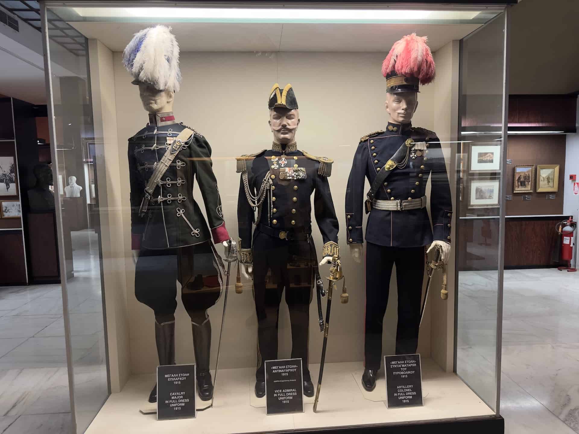 Cavalry major in full dress uniform, 1915 (left); Vice admiral in full dress uniform (center); Artillery colonel in full dress uniform, 1915 (right) at the War Museum in Athens, Greece